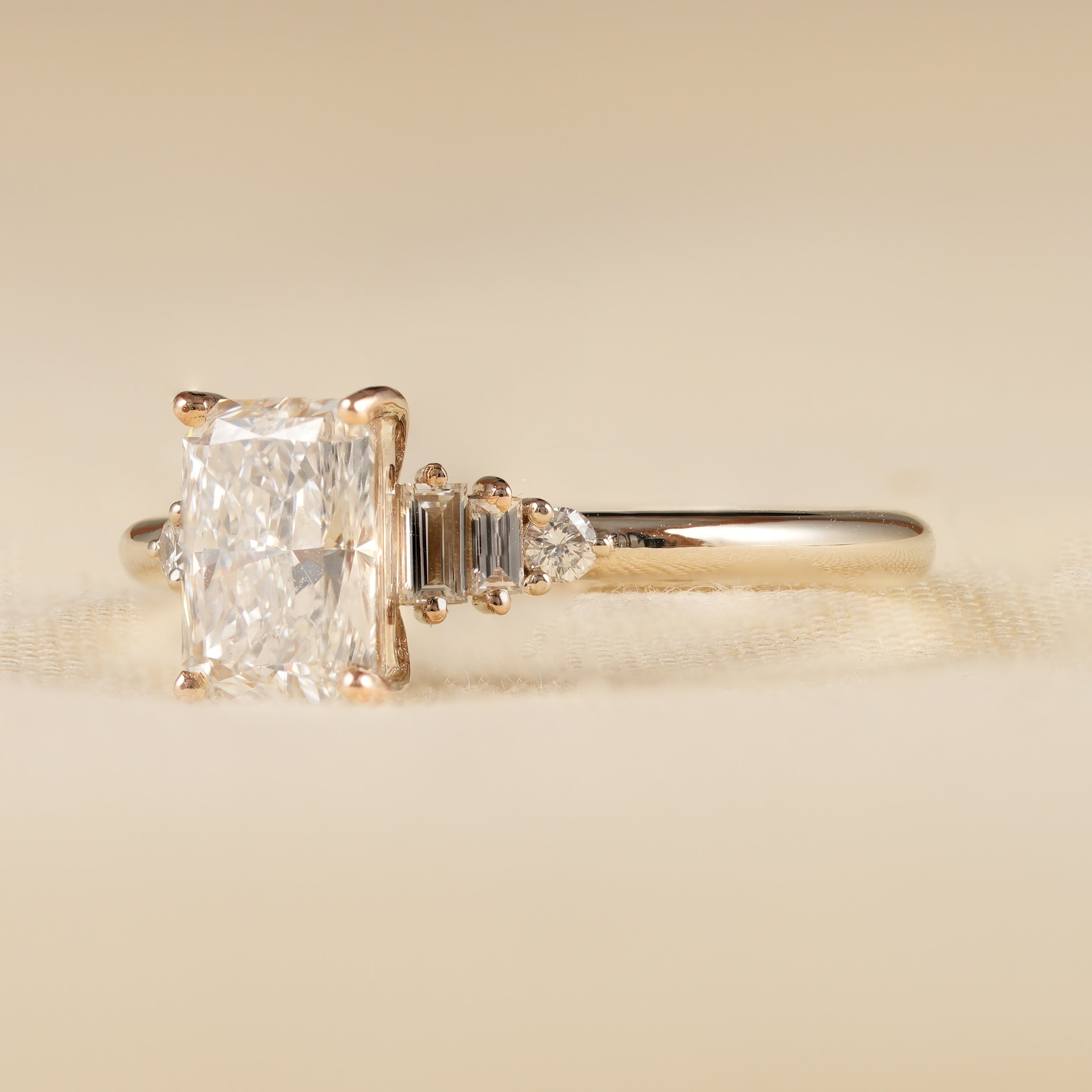 Three Stone Radiant Cut Diamond Ring in Yellow Gold Setting