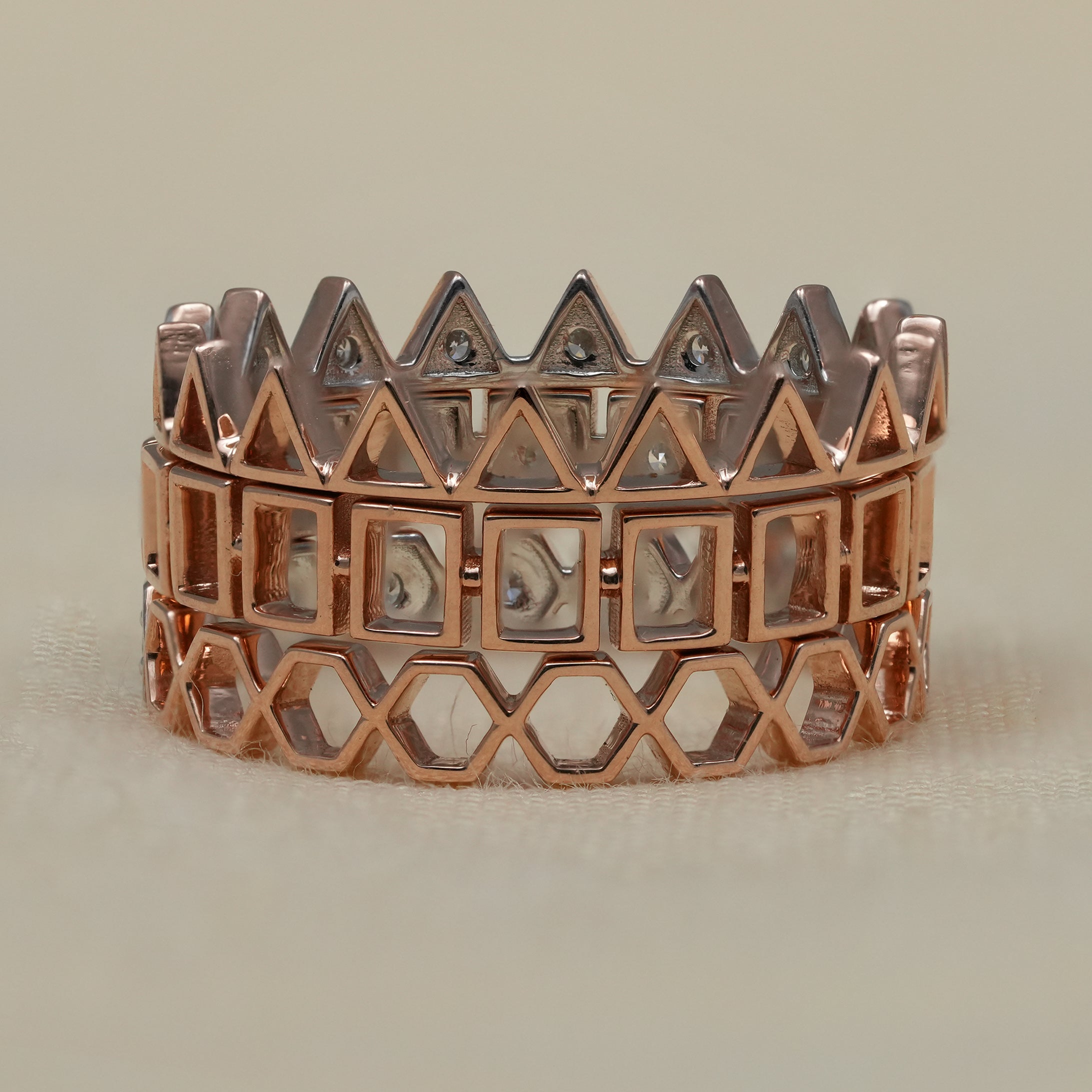 Bold architectural diamond stack rings with triangular and hex details