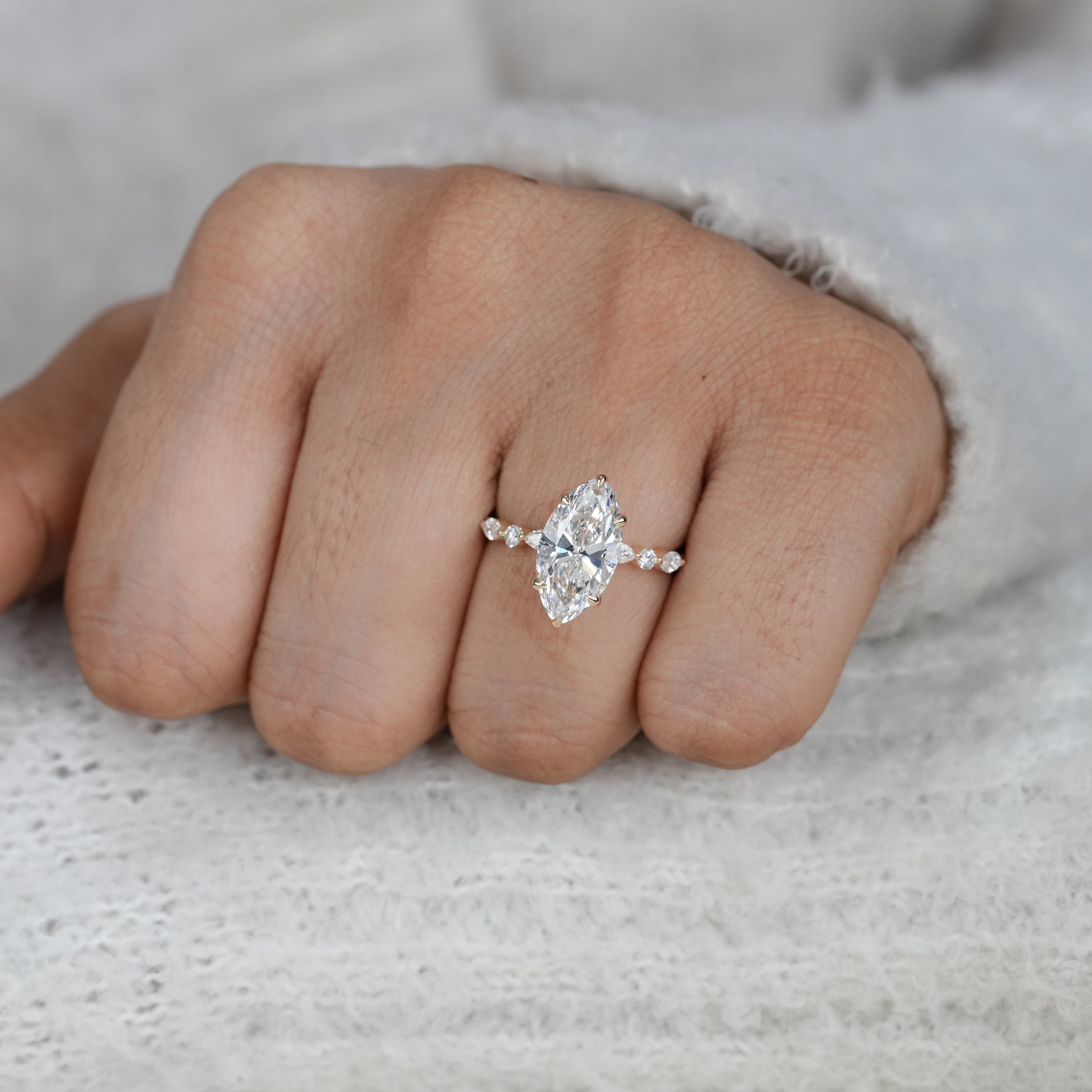 Modern marquise lab grown diamond ring in polished yellow gold