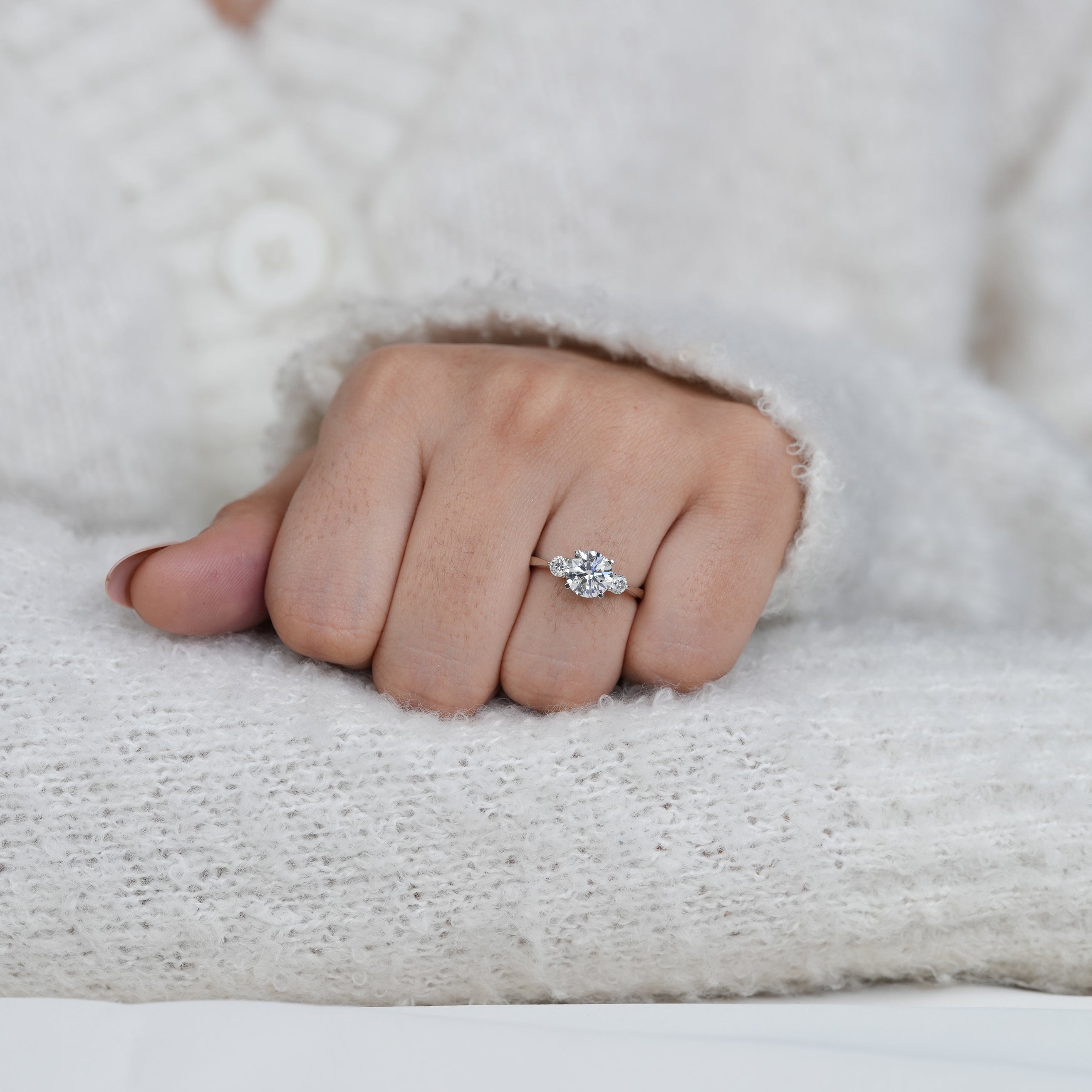 Fine white gold ring featuring round lab grown diamond center