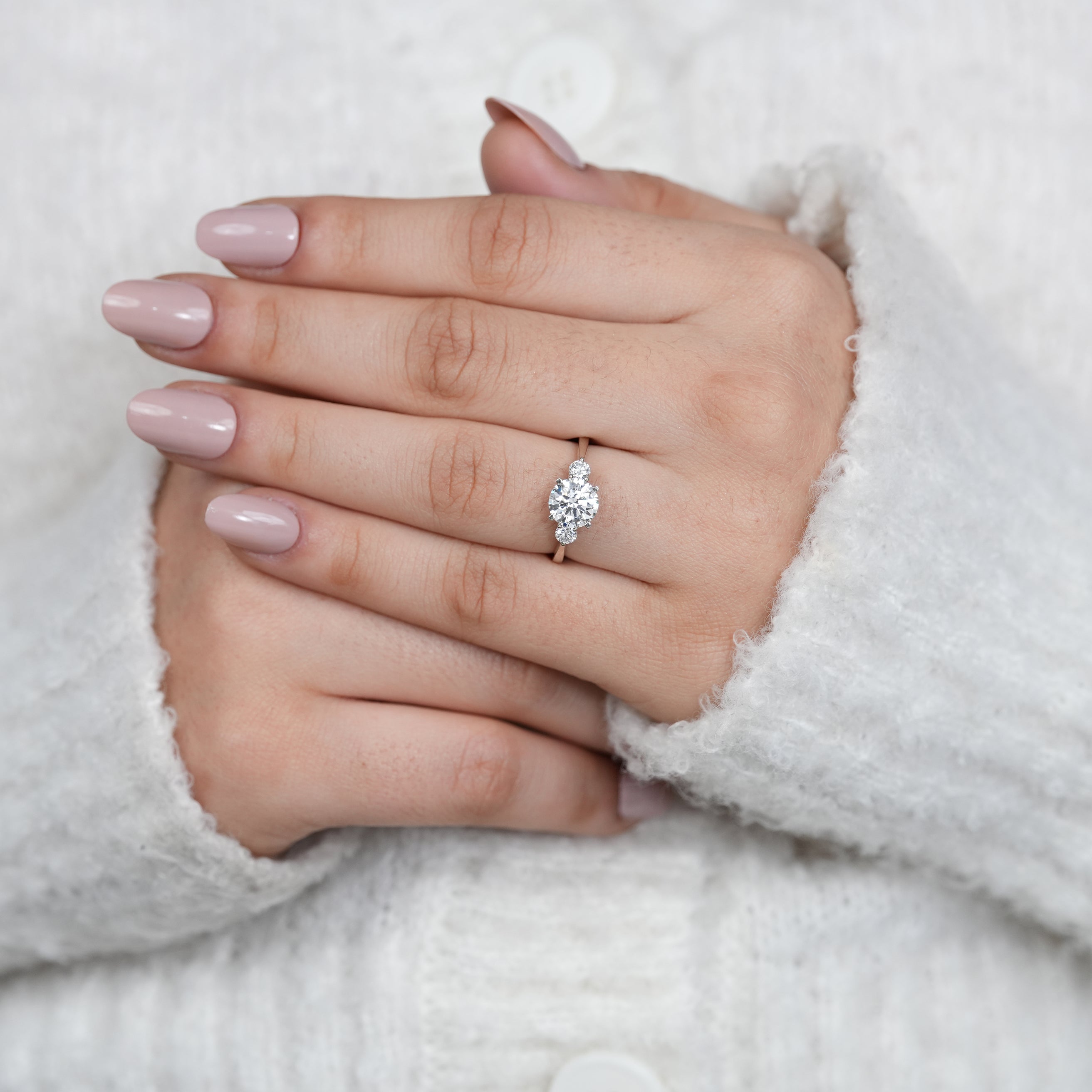 Delicate three stone lab grown diamond ring in sleek white gold