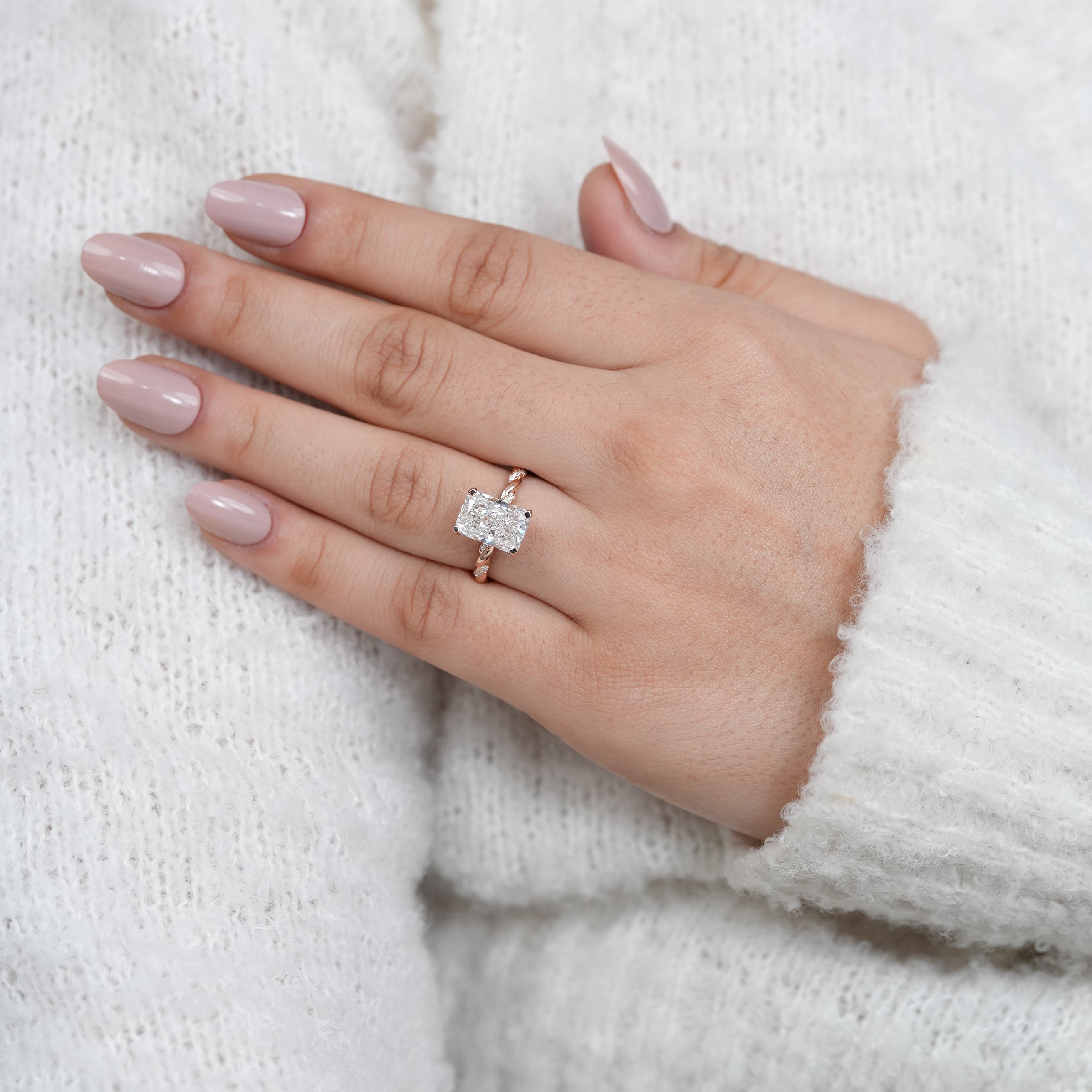 Modern radiant lab grown diamond solitaire with twisted rose gold shank