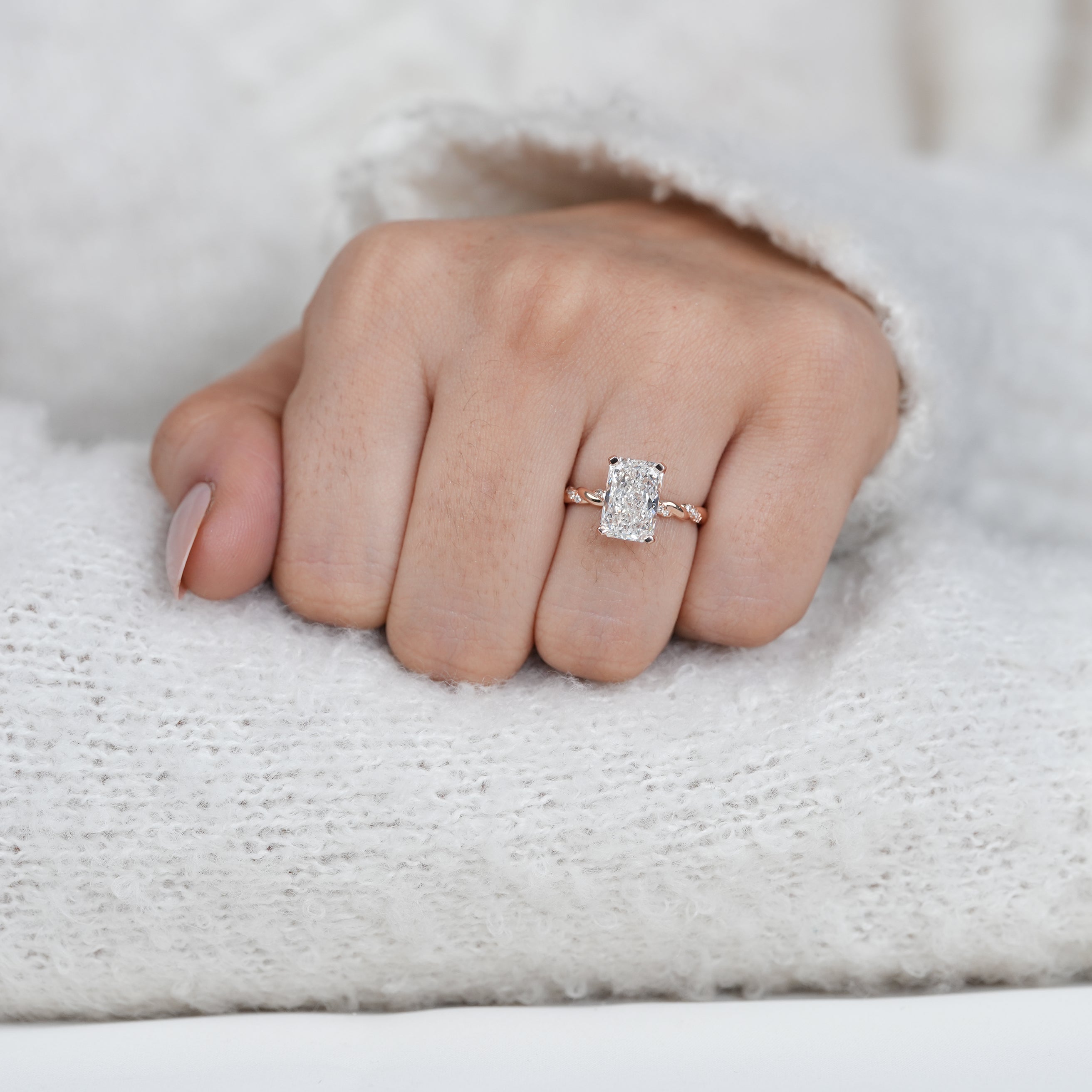 Radiant lab grown diamond ring with delicate pavé set twisted band