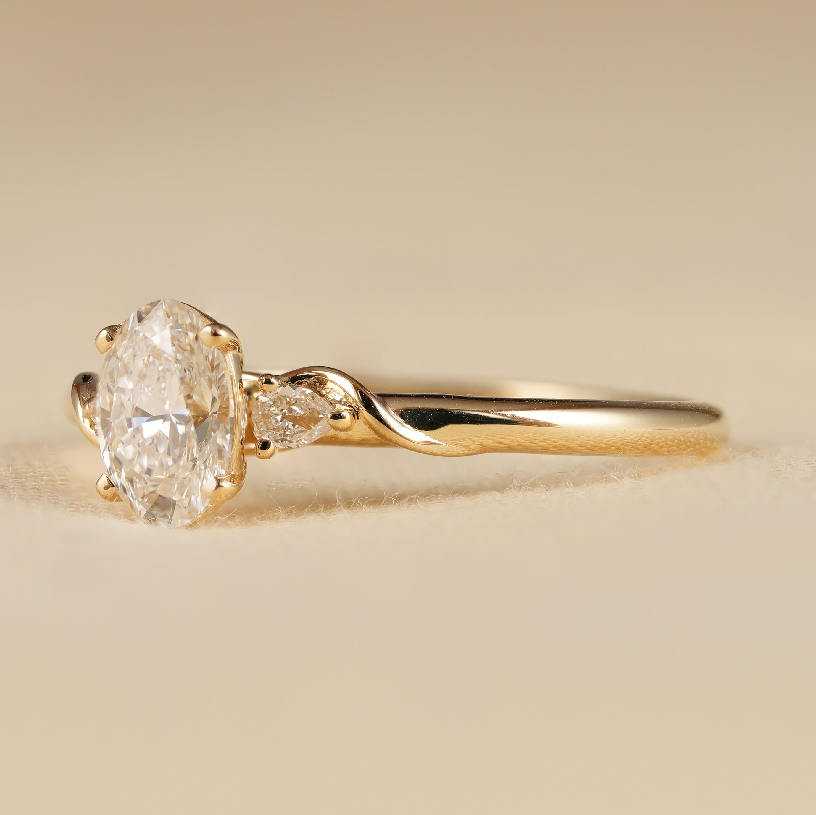 Oval Cut Lab Diamond Ring with Pear Accent Stones in Yellow Gold