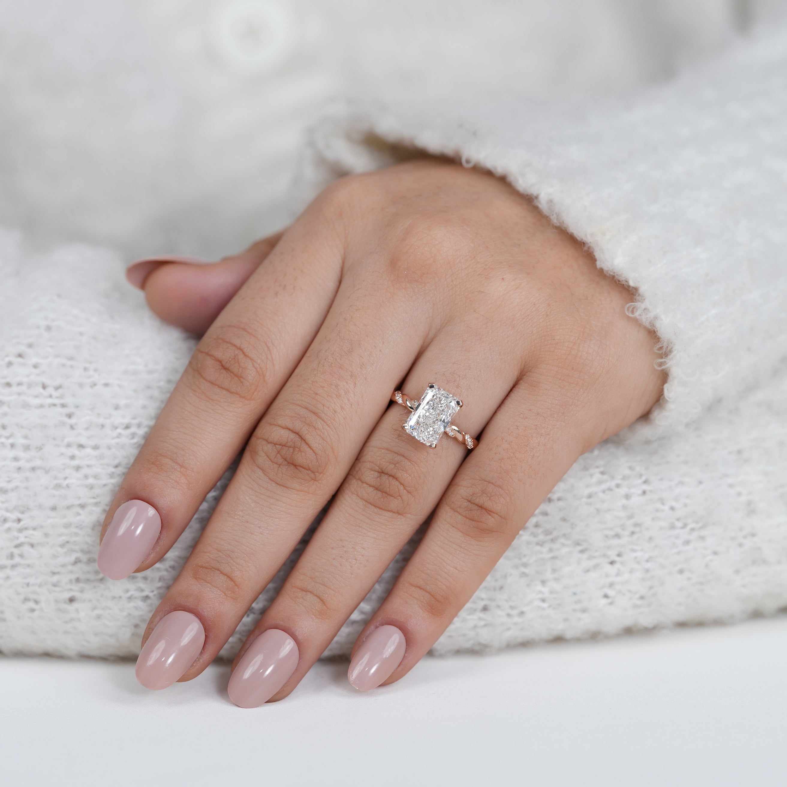 Contemporary radiant lab grown diamond ring in polished rose gold setting