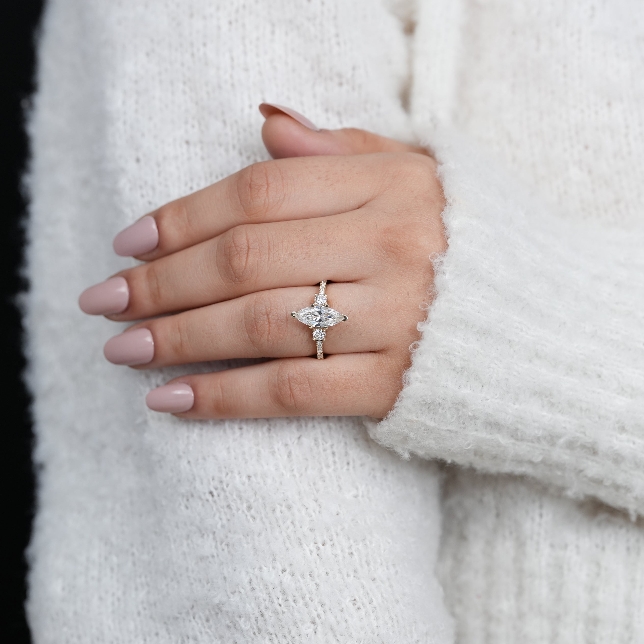 Yellow gold marquise lab grown diamond ring with round side diamonds