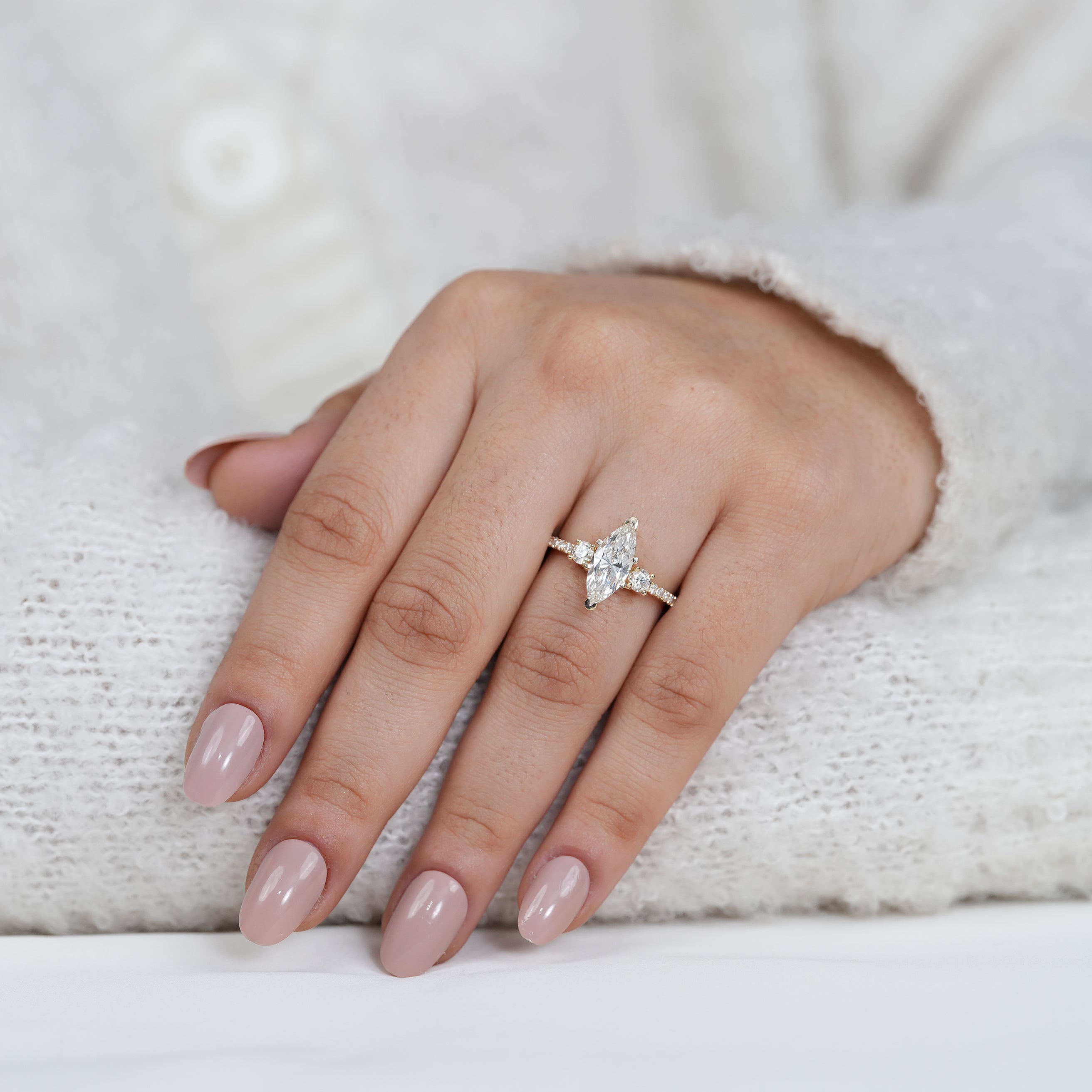 Timeless marquise lab grown diamond ring with sparkling side stones
