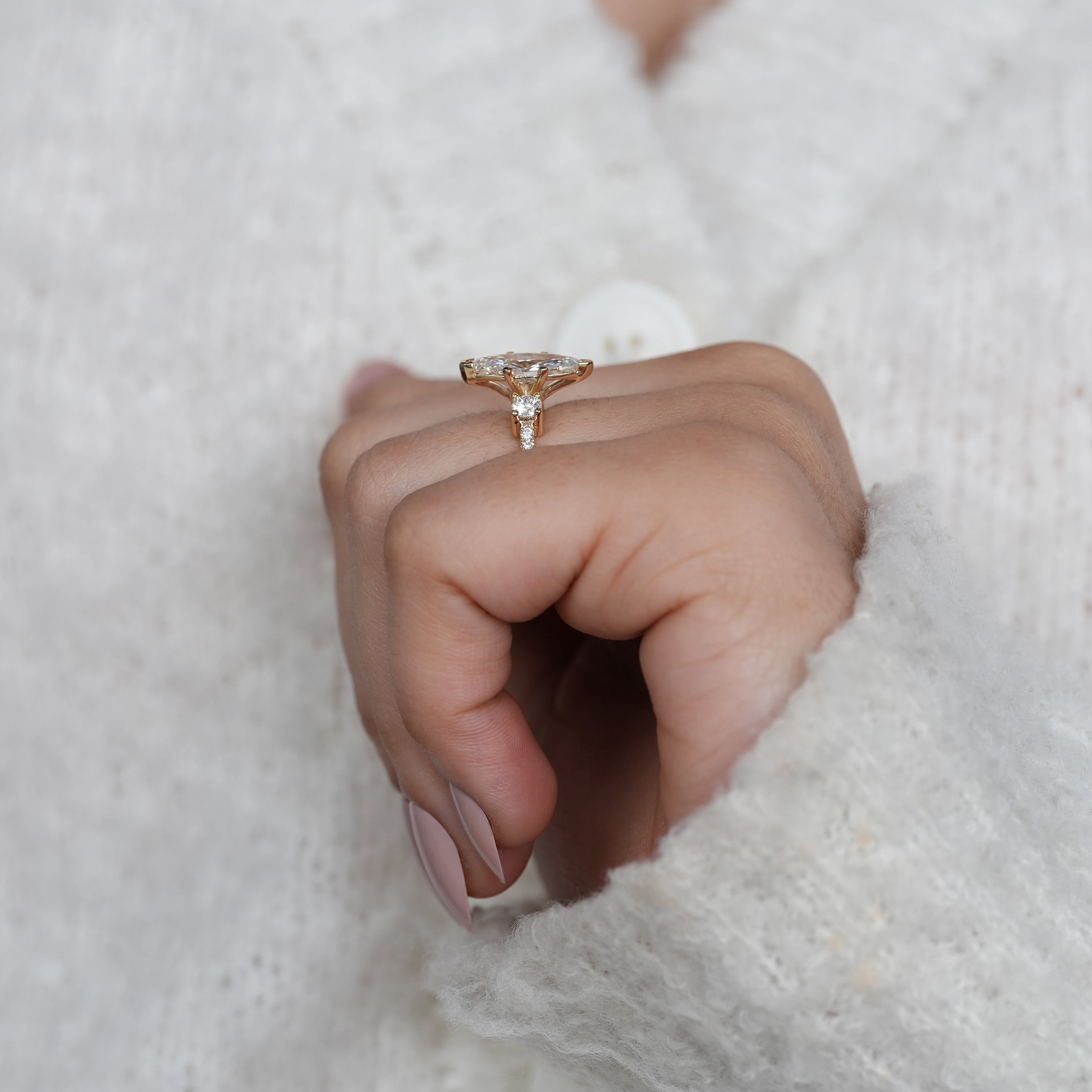Timeless marquise lab grown diamond ring with sparkling side stones
