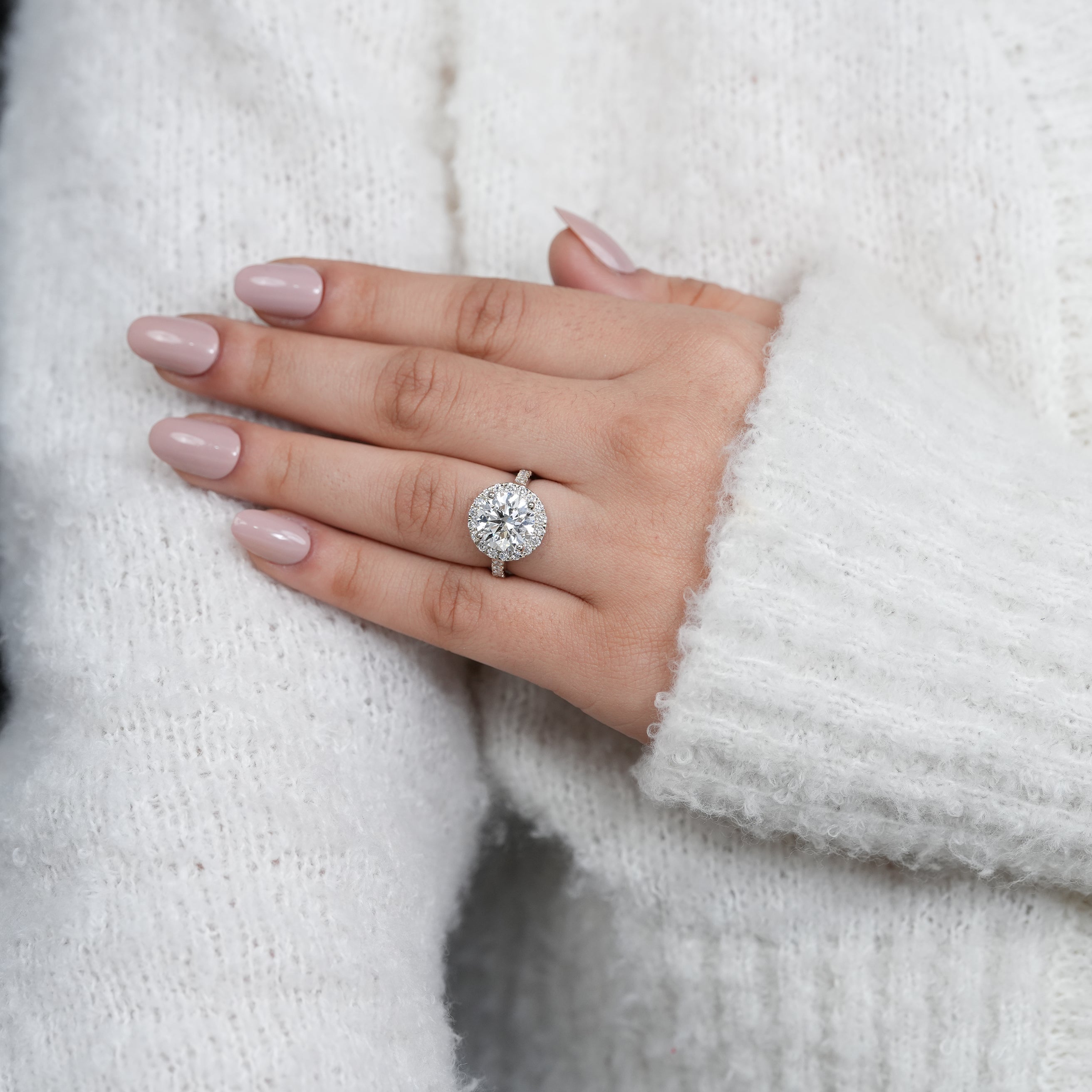 Elegant yellow gold halo engagement ring with round lab grown diamond