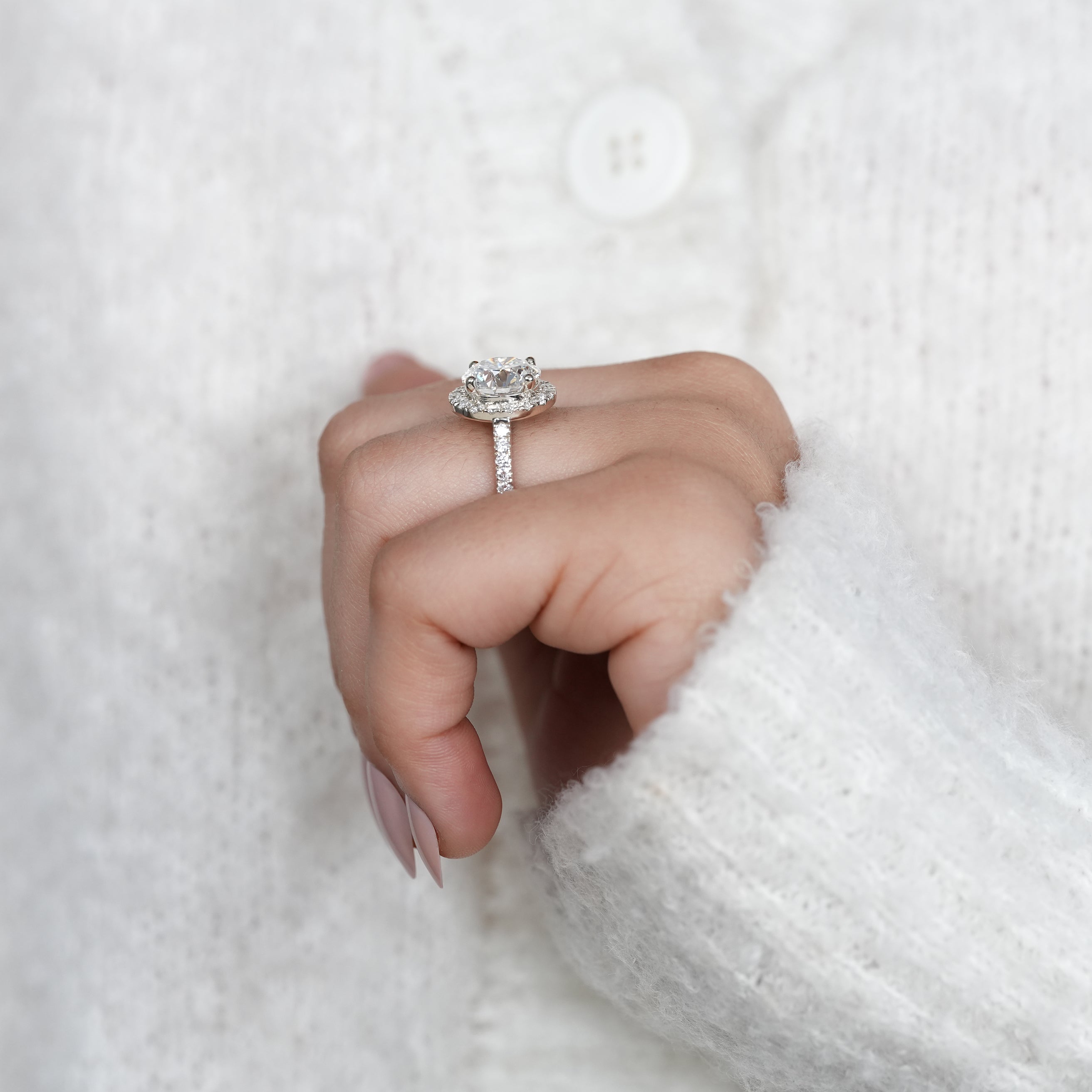 Modern halo engagement ring with round lab grown diamond centerpiece