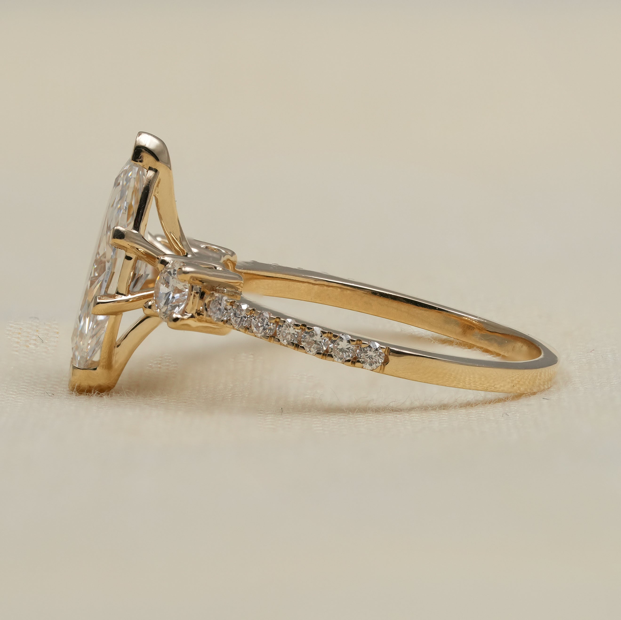 Elegant marquise lab grown diamond ring with pavé yellow gold band