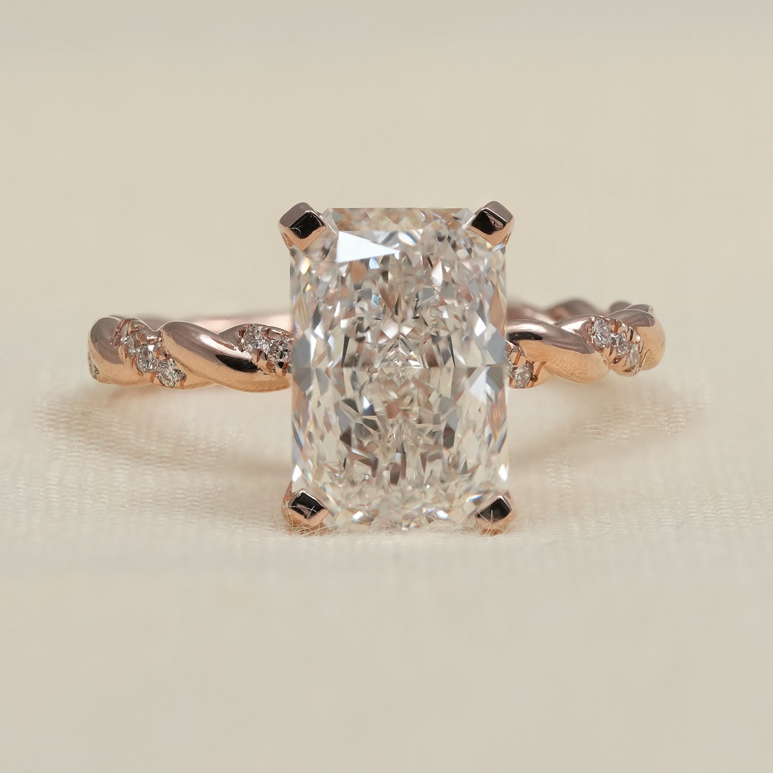 Radiant lab grown diamond engagement ring with rose gold twisted band