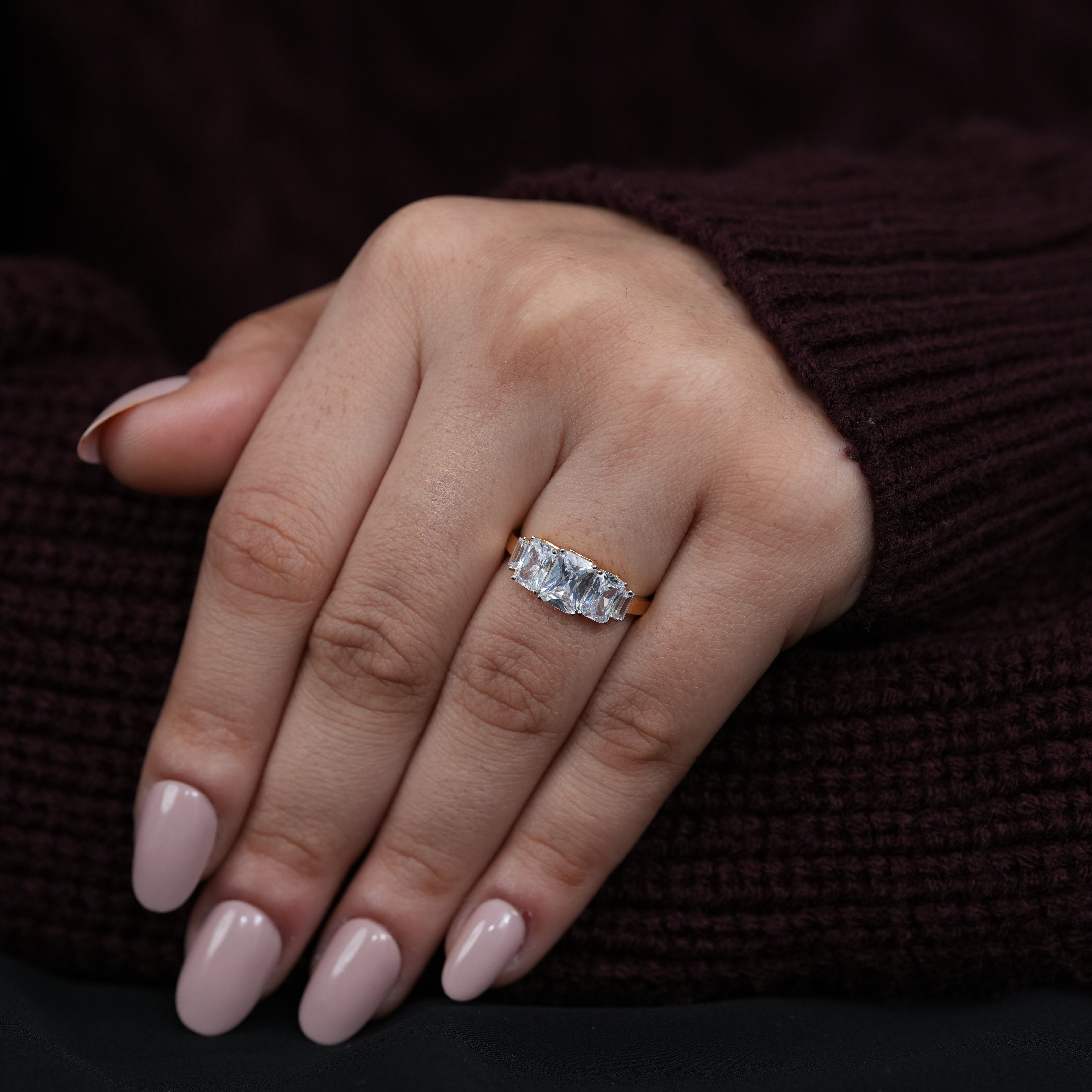 Radiant three stone lab grown diamond ring with polished yellow gold