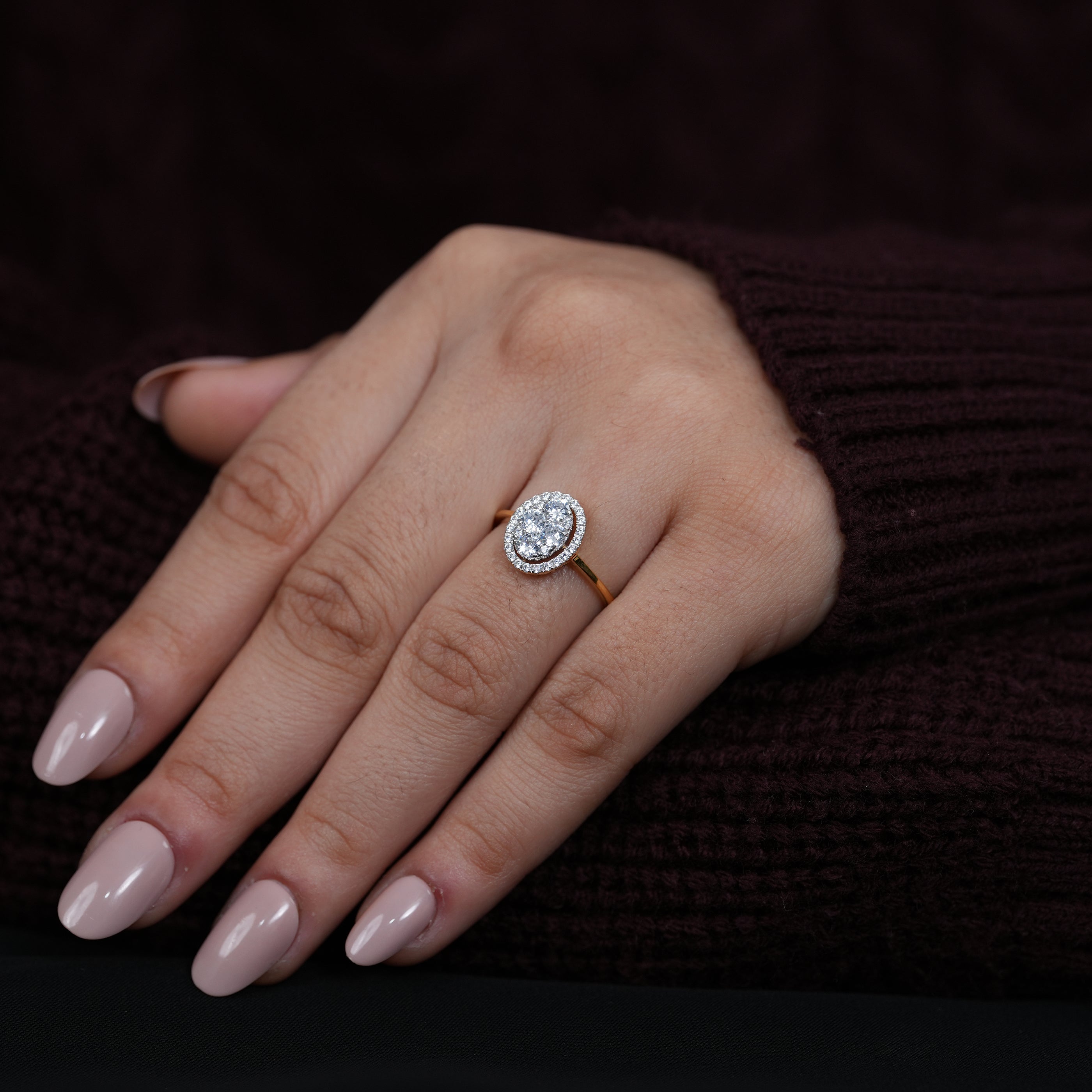 Luxury oval cluster diamond engagement ring with surrounding halo sparkle