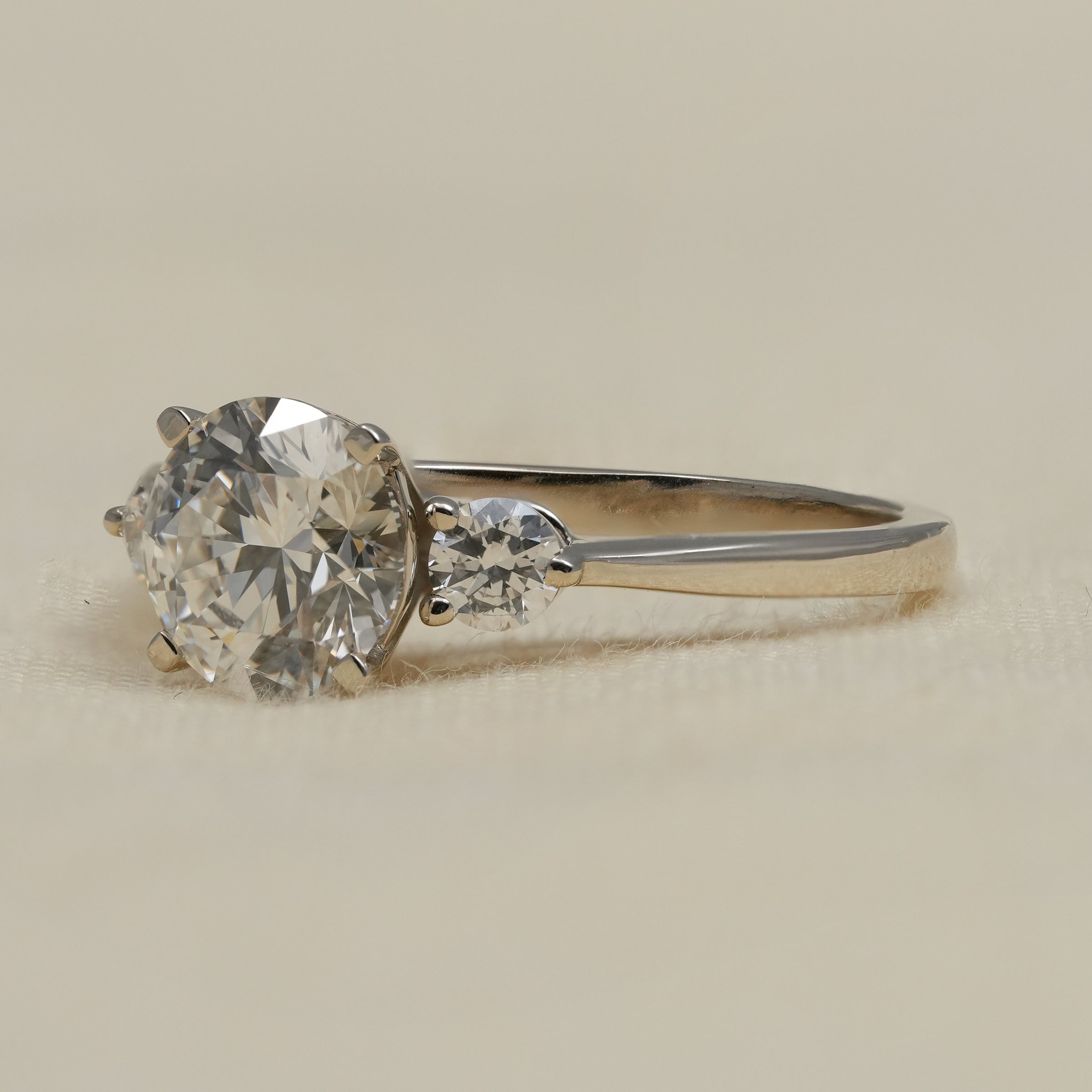 Classic three stone lab grown diamond ring with polished white gold