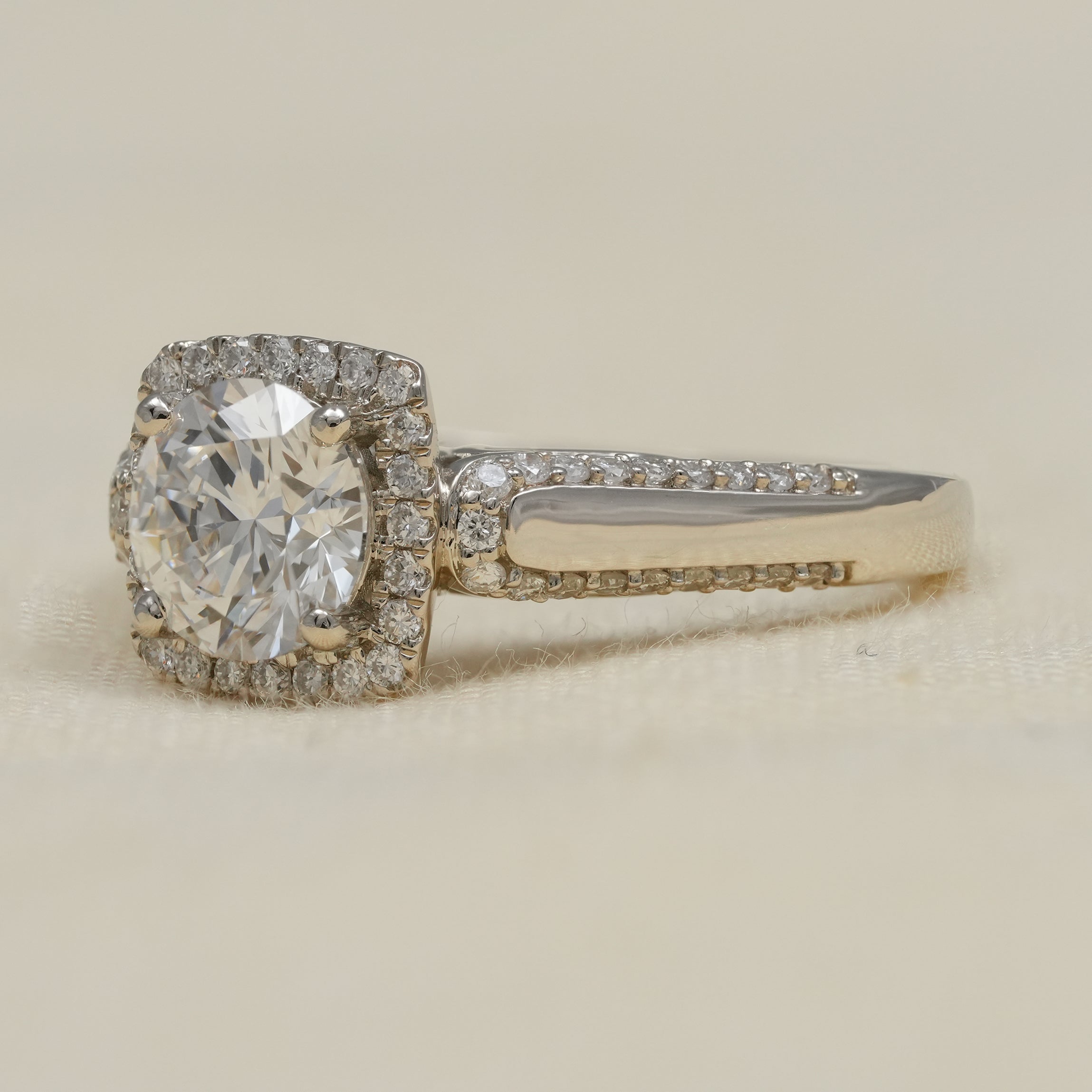 White gold halo ring featuring round lab grown diamond center stone