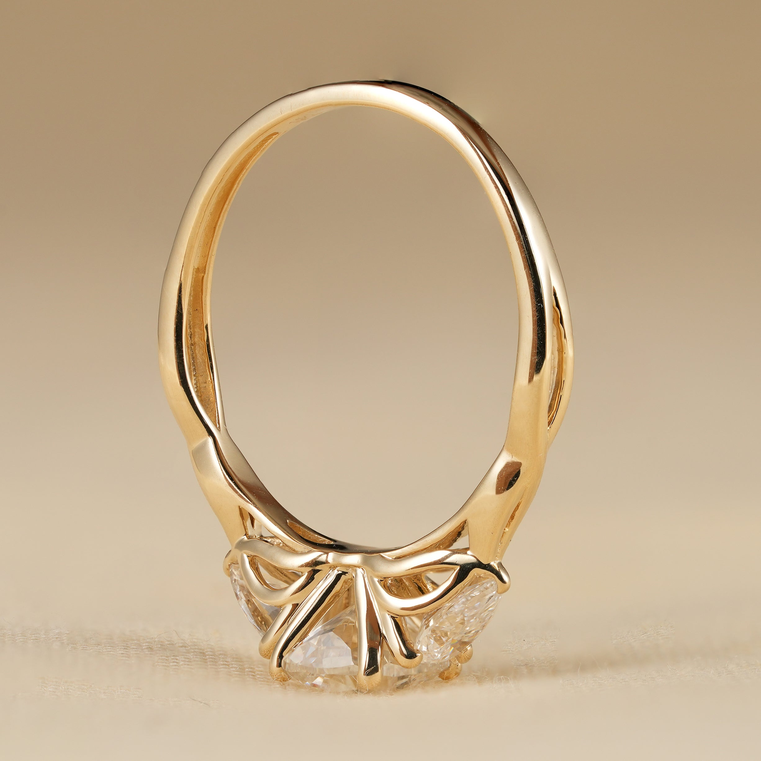 Romantic Twisted Band Cushion Cut Engagement Ring with Pear Accents