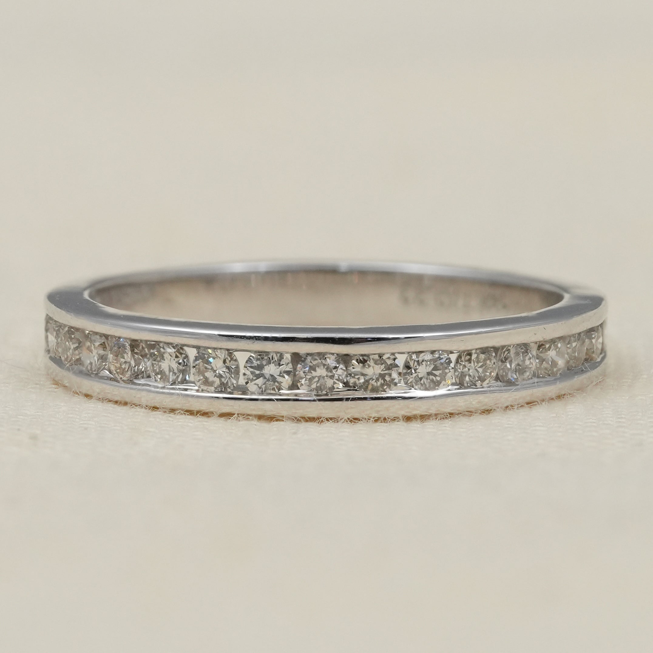 Minimalist lab grown diamond eternity band with channel set stones