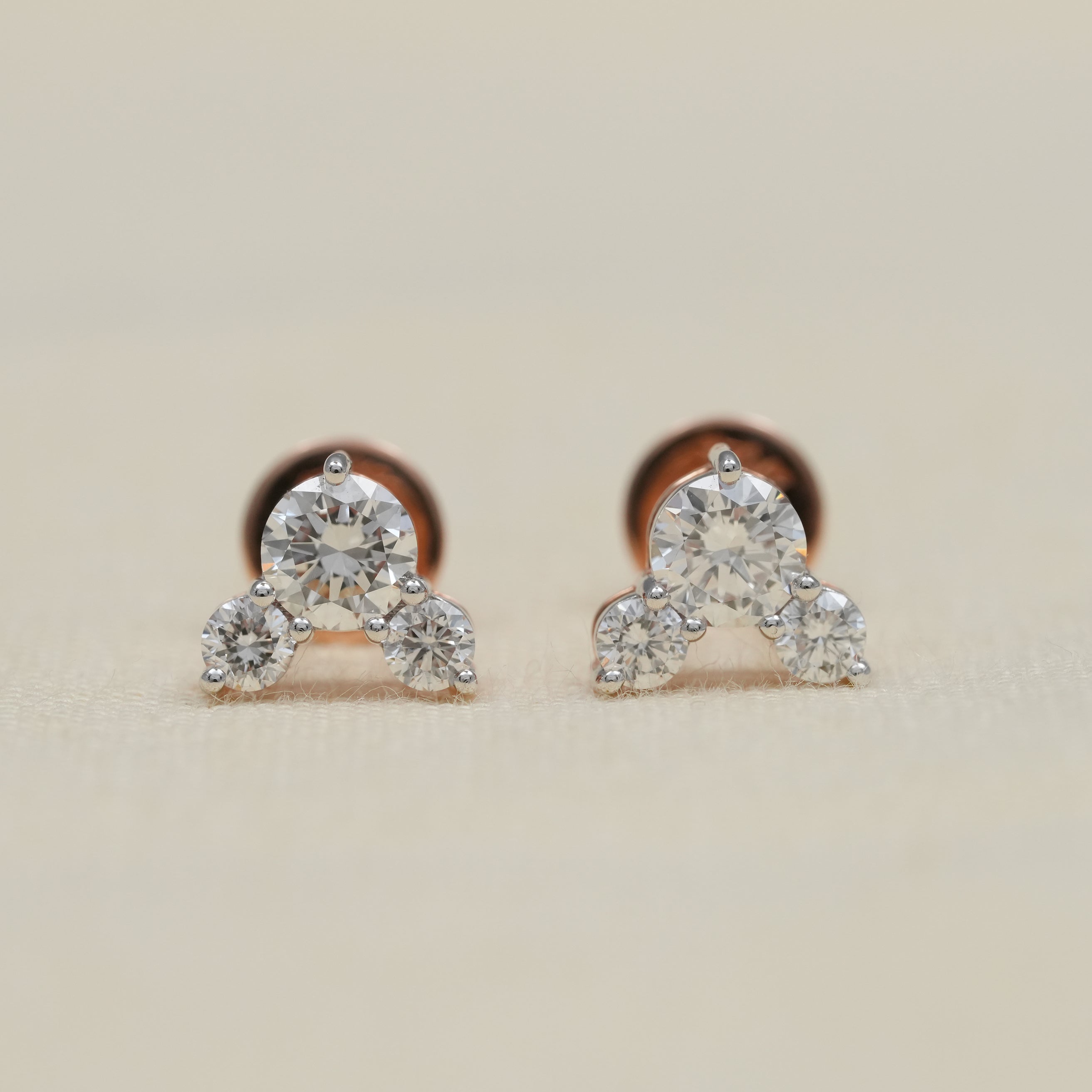 Three stone lab grown diamond stud earrings in rose gold