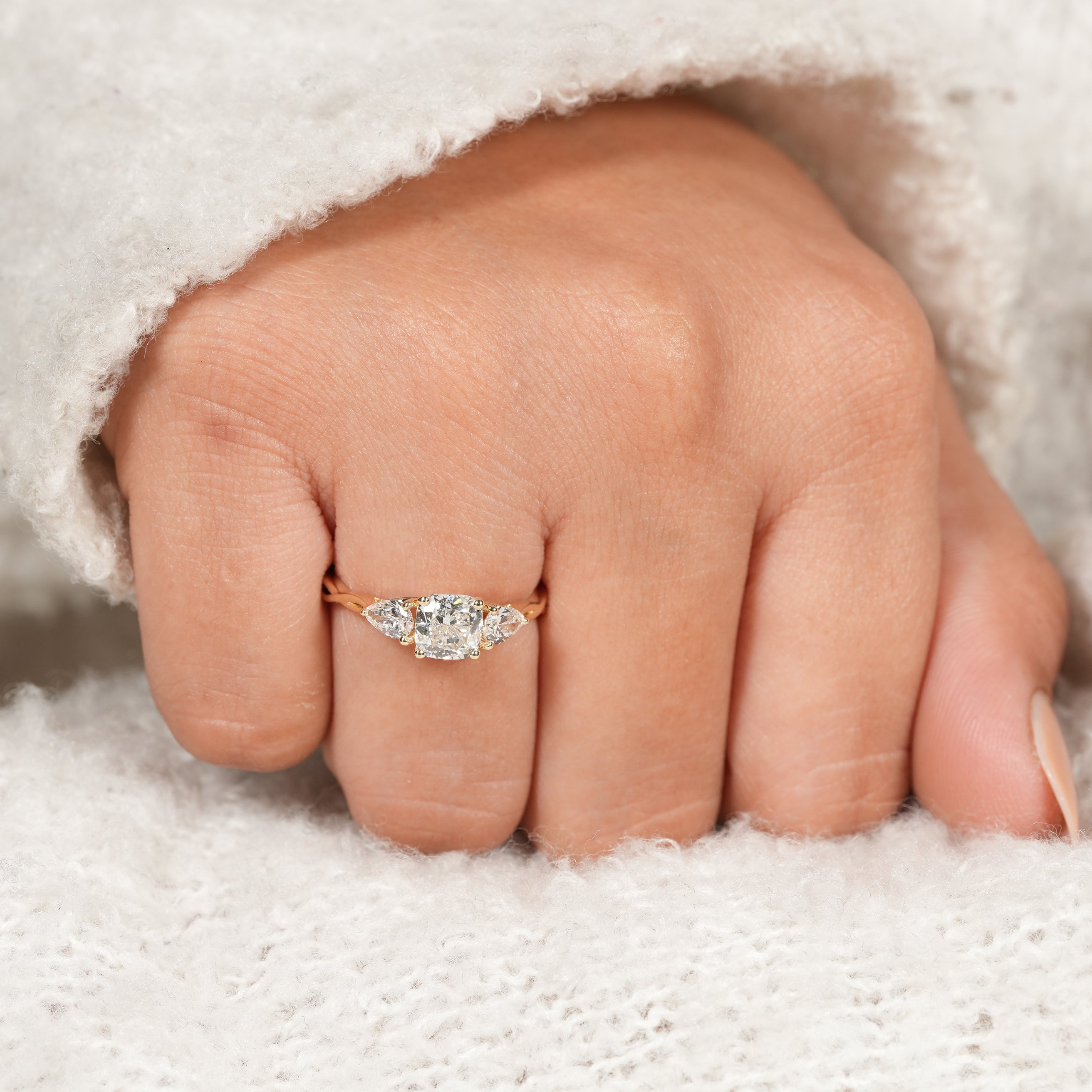 Modern Three Stone Cushion Diamond Ring with Unique Twisted Setting