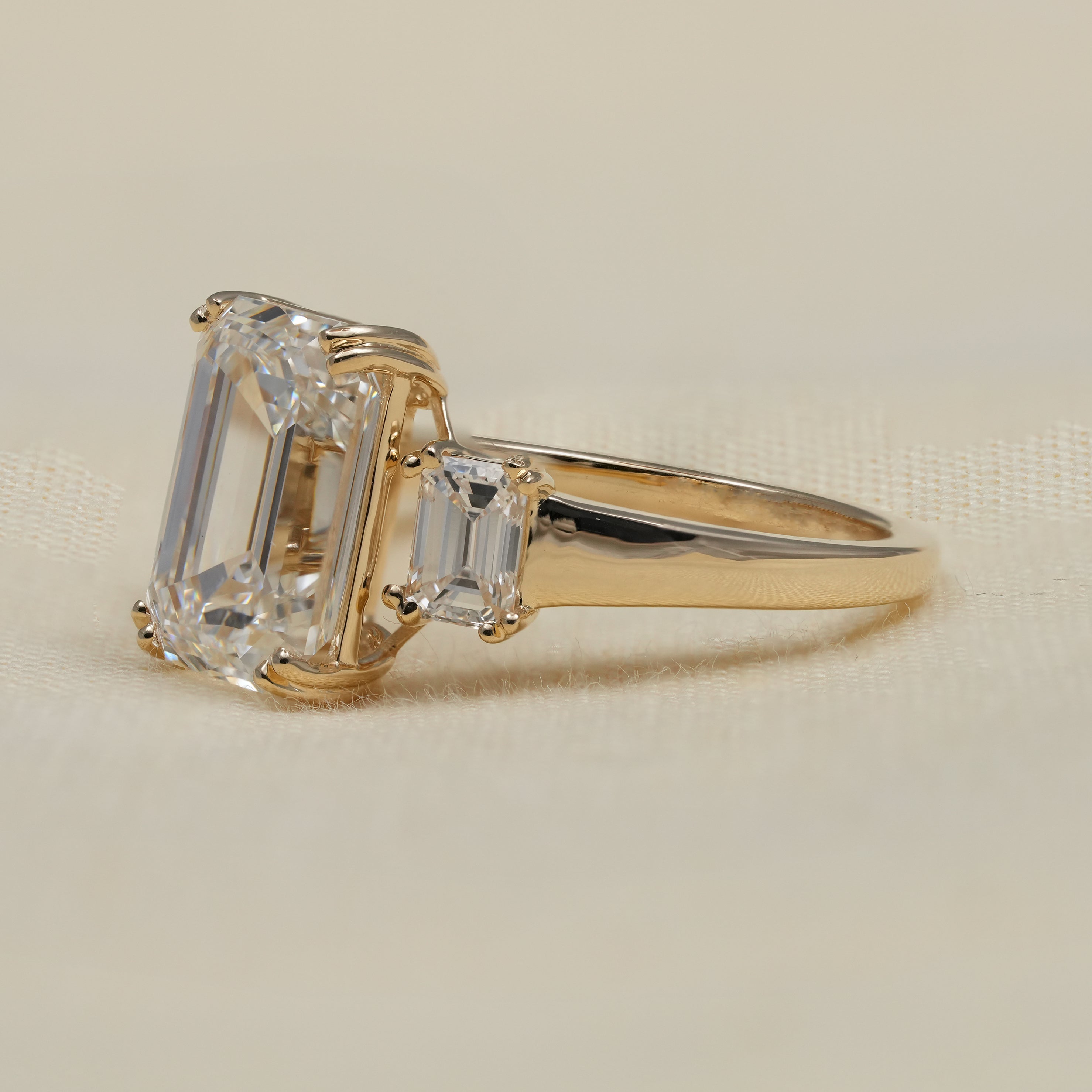 Luxury emerald cut lab grown diamond ring in polished yellow gold