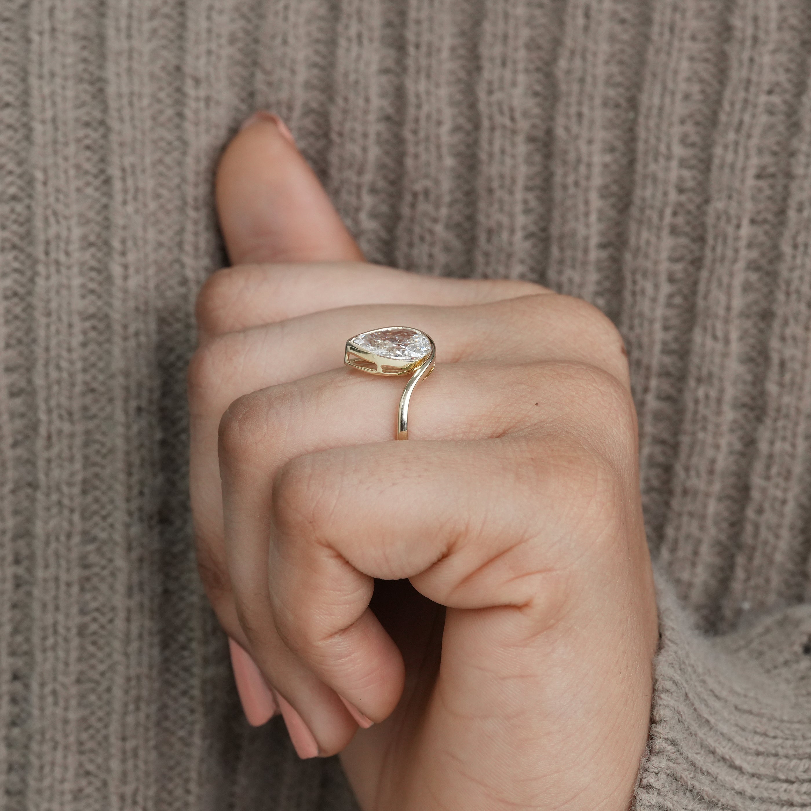 Luxury pear lab grown diamond bypass ring sleek modern bridal design