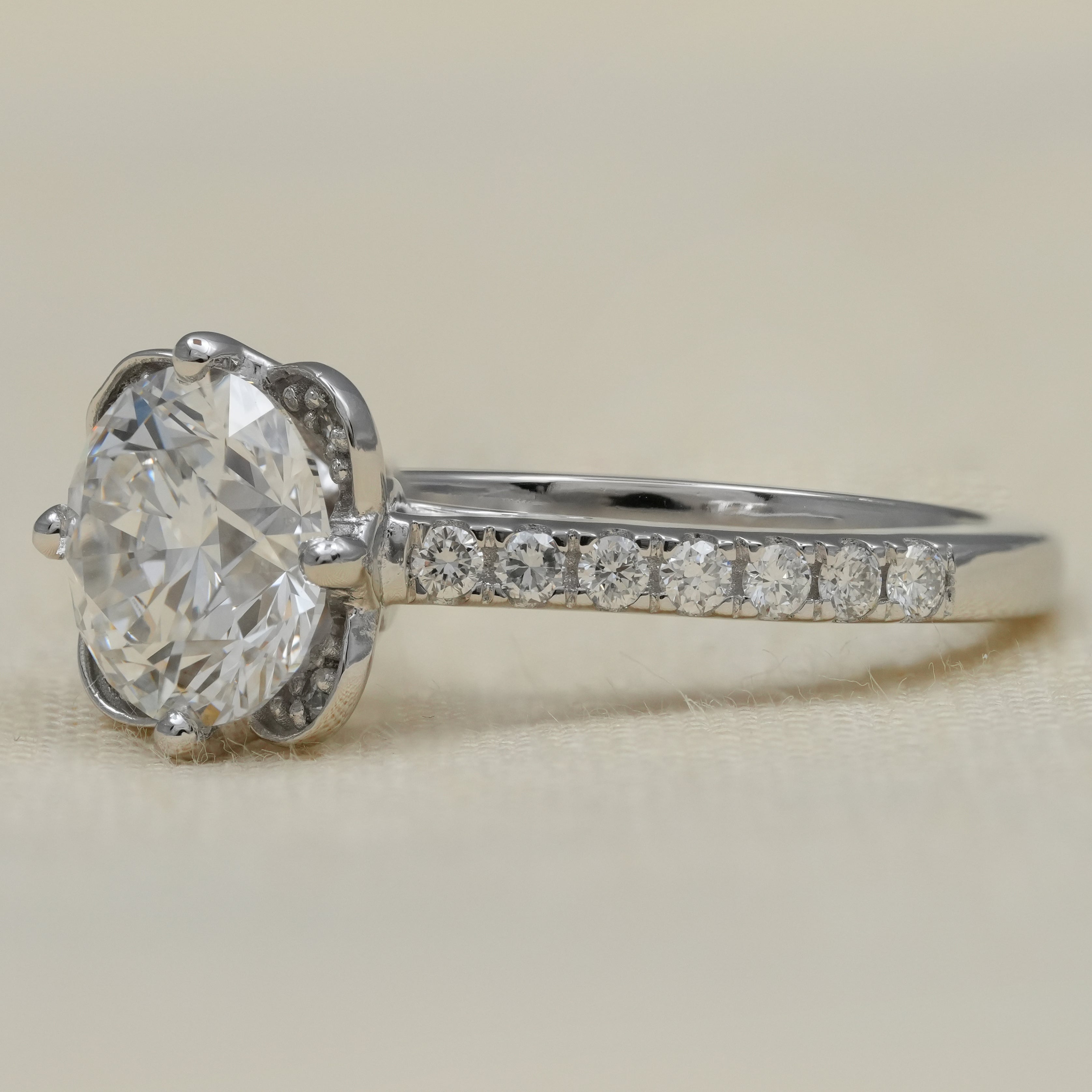 White gold floral solitaire lab grown diamond ring pavé shoulders