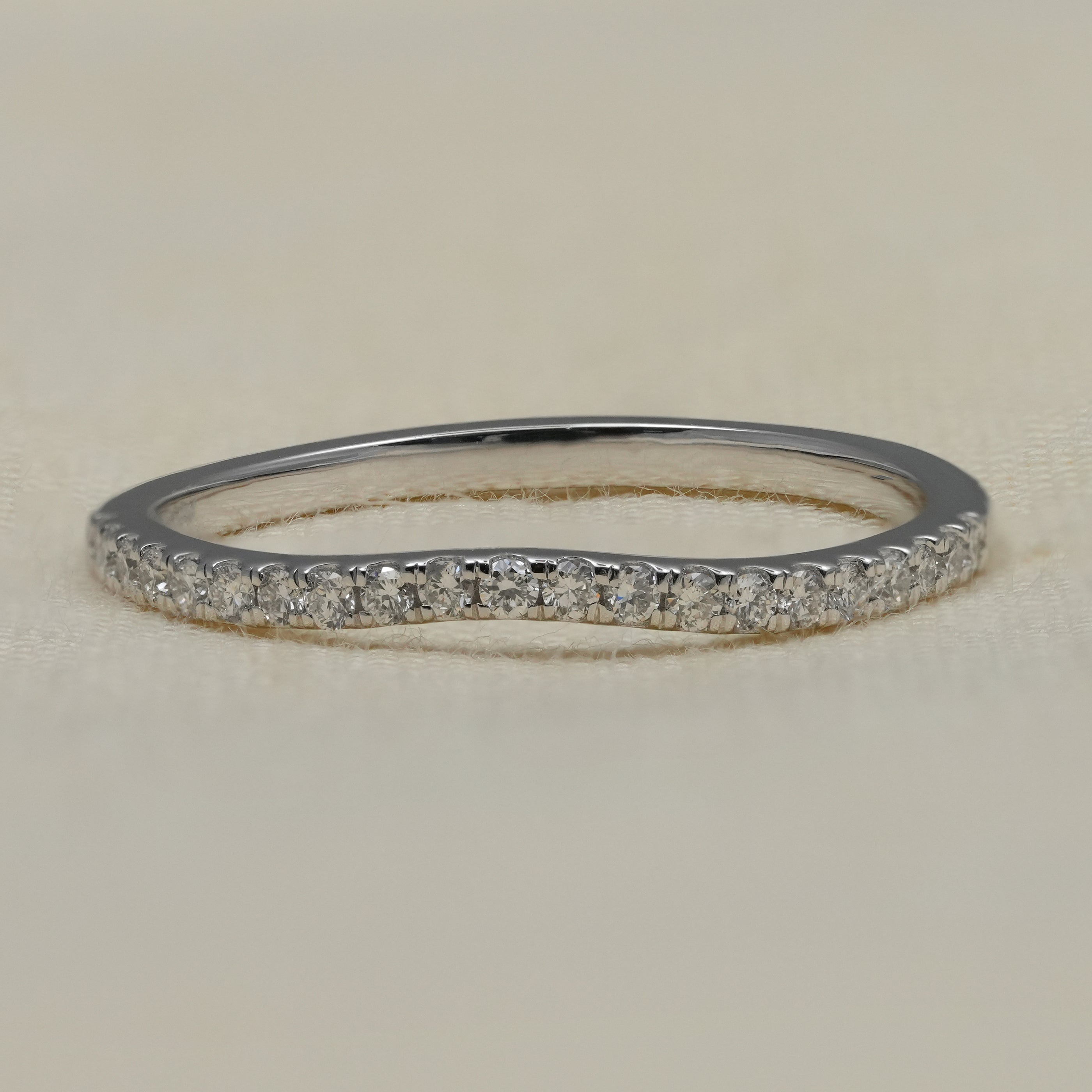 Curved pavé lab grown diamond wedding band in polished white gold