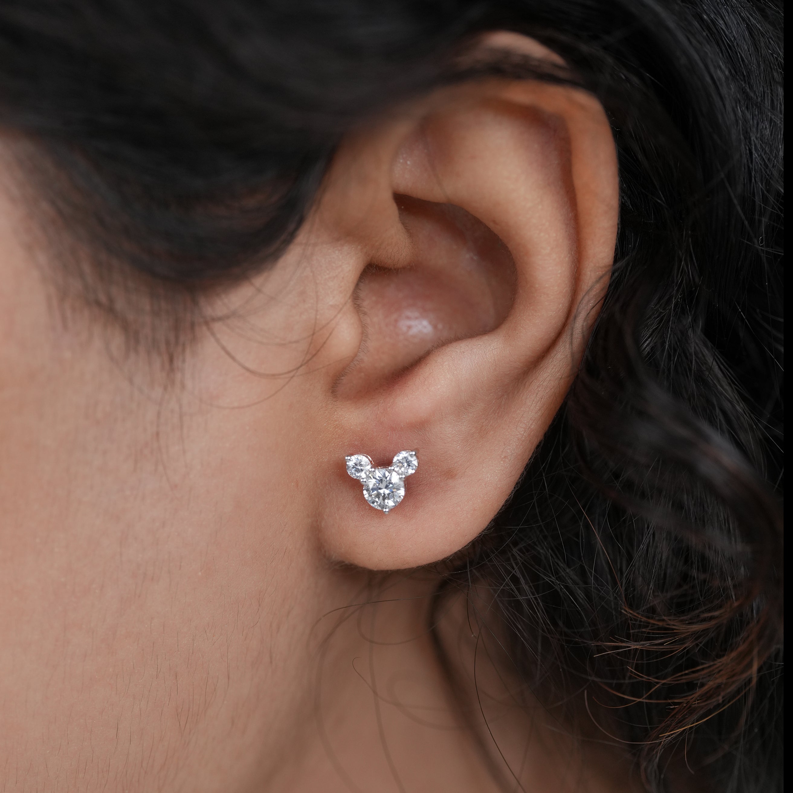 Delicate three stone lab grown diamond studs with refined sparkle