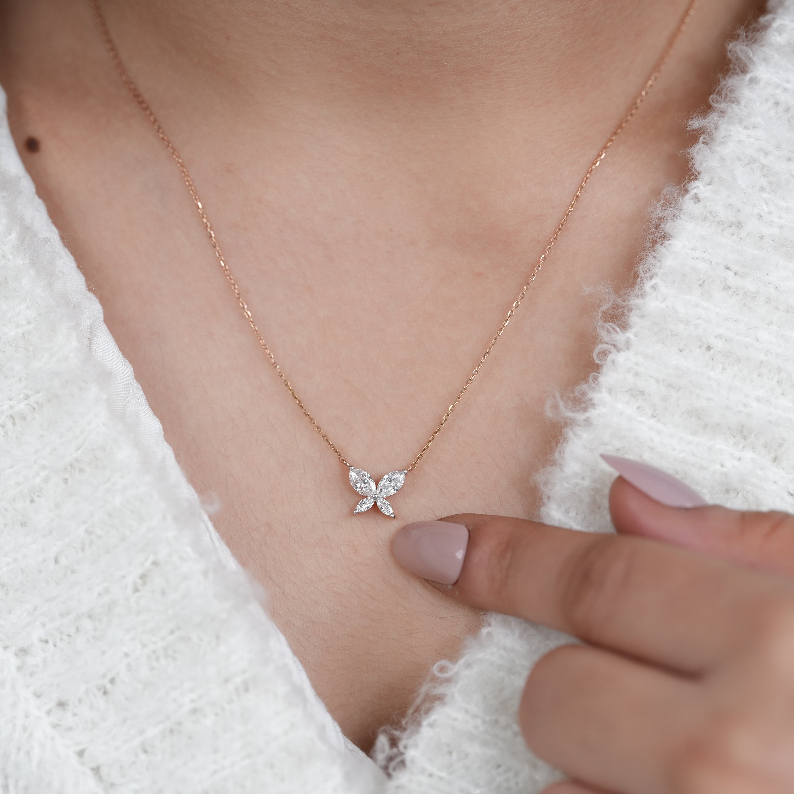 Minimalist lab grown diamond butterfly pendant in polished rose gold