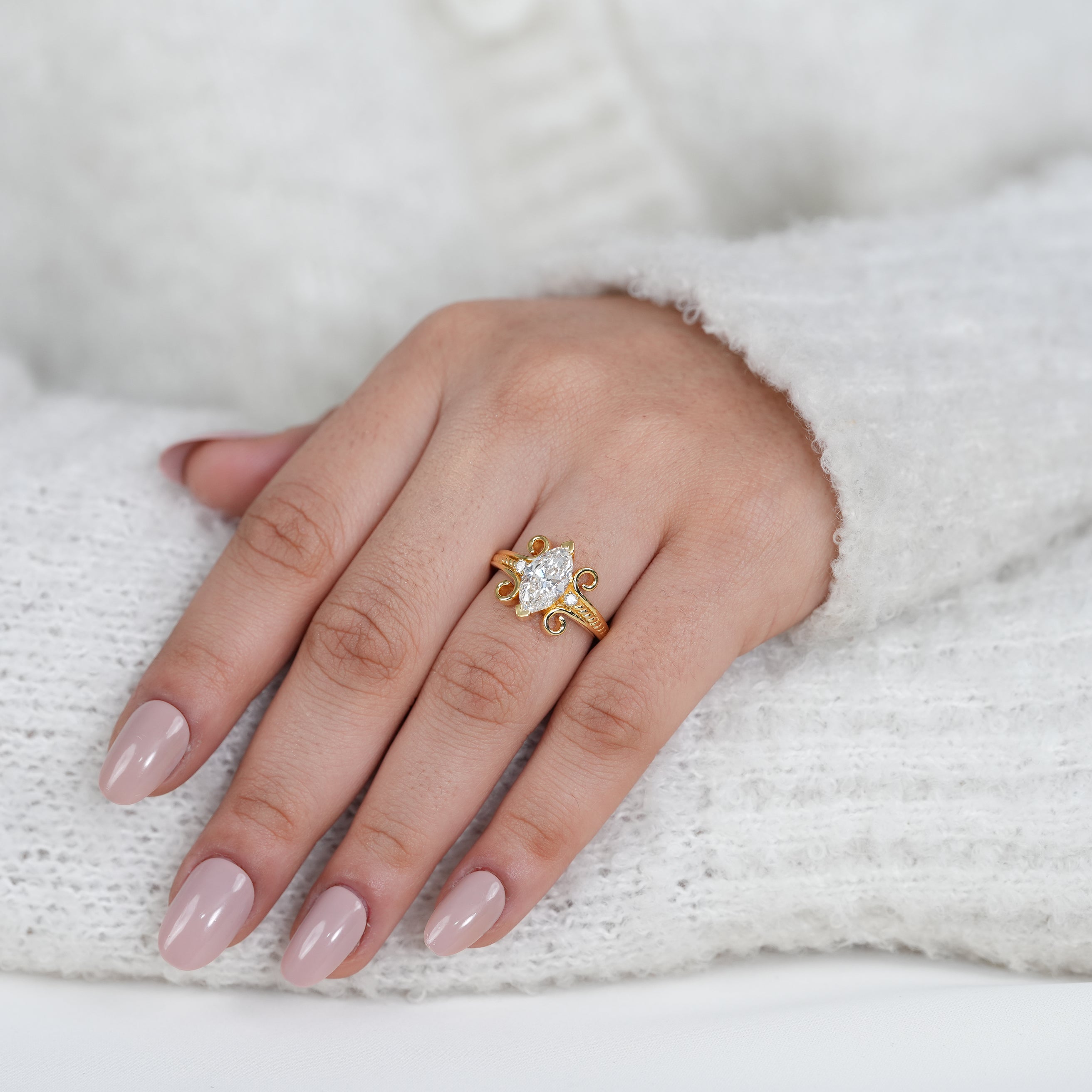 Classic marquise lab grown diamond engagement ring with ornate gold band