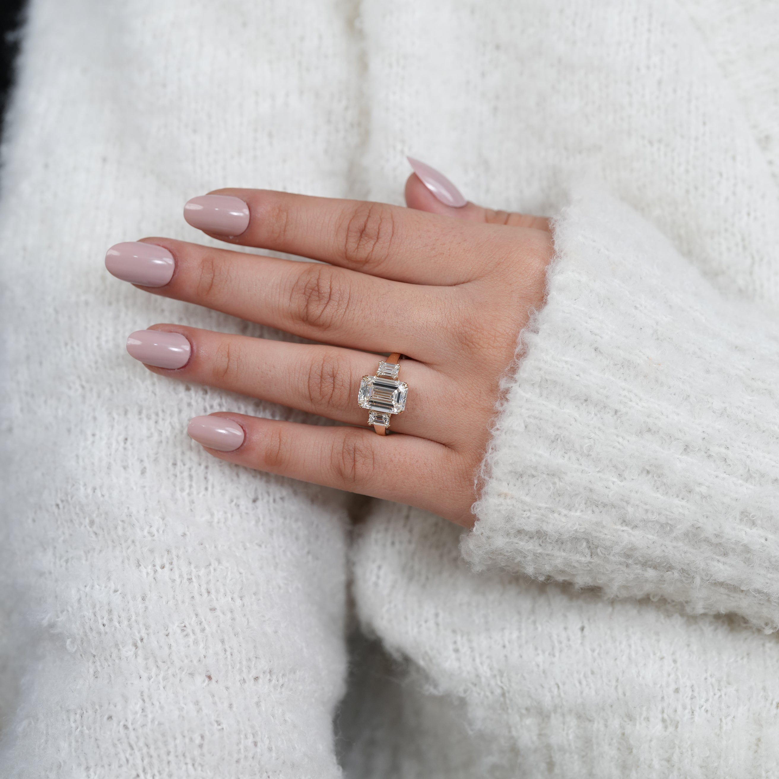 Classic three stone lab grown diamond engagement ring emerald cut