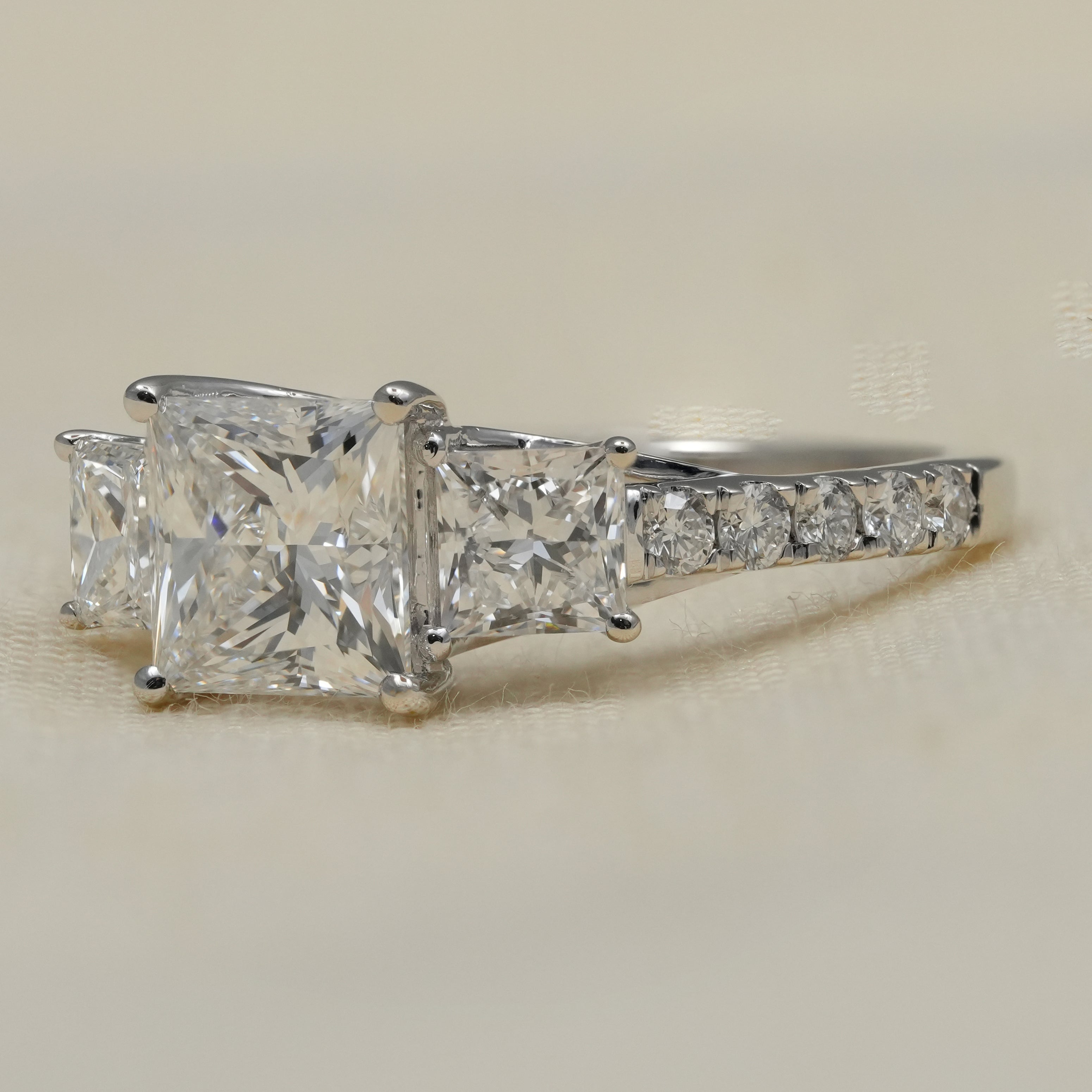 Three stone princess lab grown diamond ring pavé band bridal style