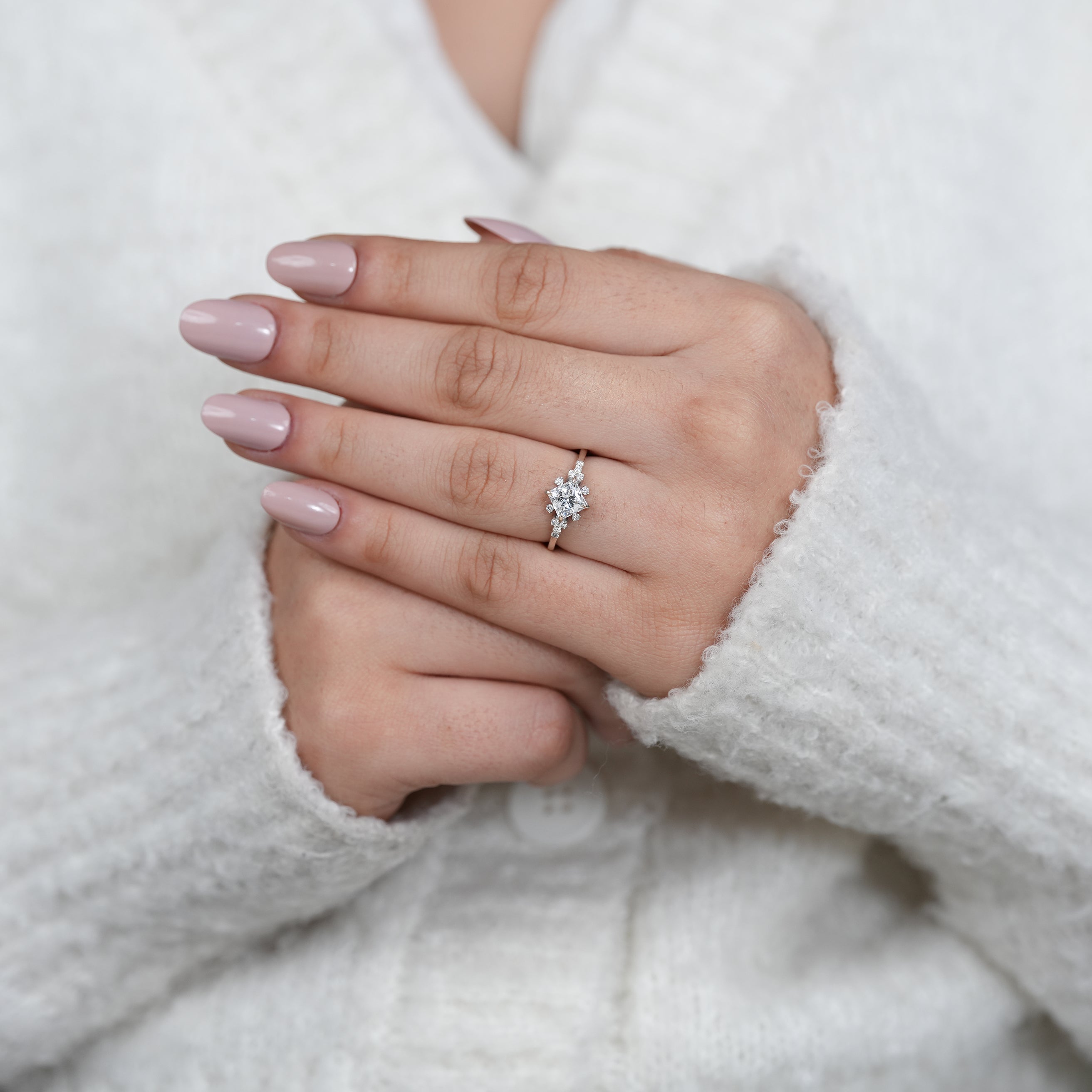 Close up princess lab grown diamond ring with intricate side clusters