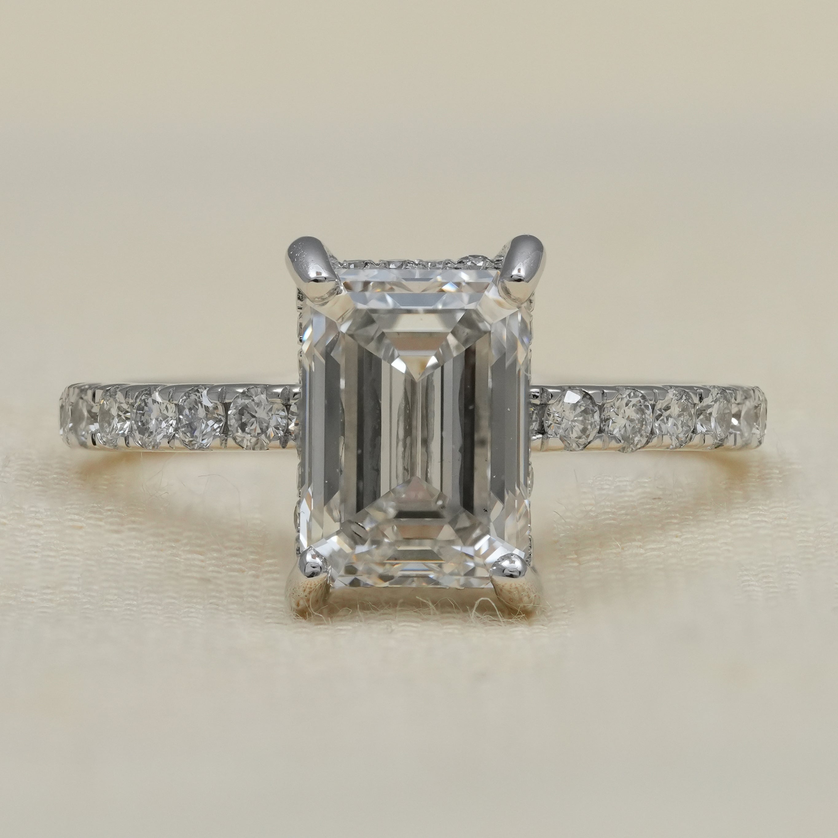 Emerald cut lab grown diamond engagement ring pavé band white gold