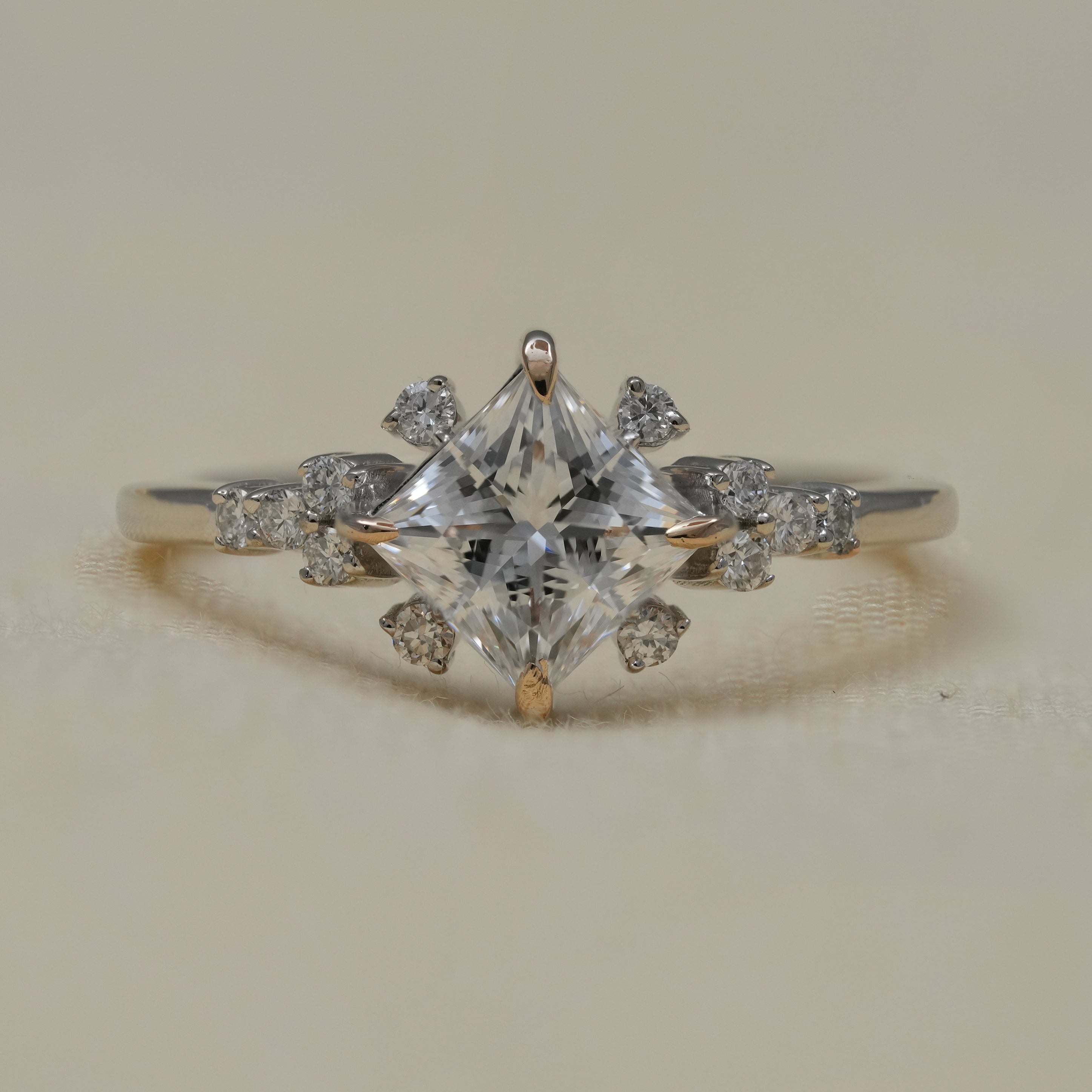 Princess cut lab grown diamond engagement ring with floral side accents