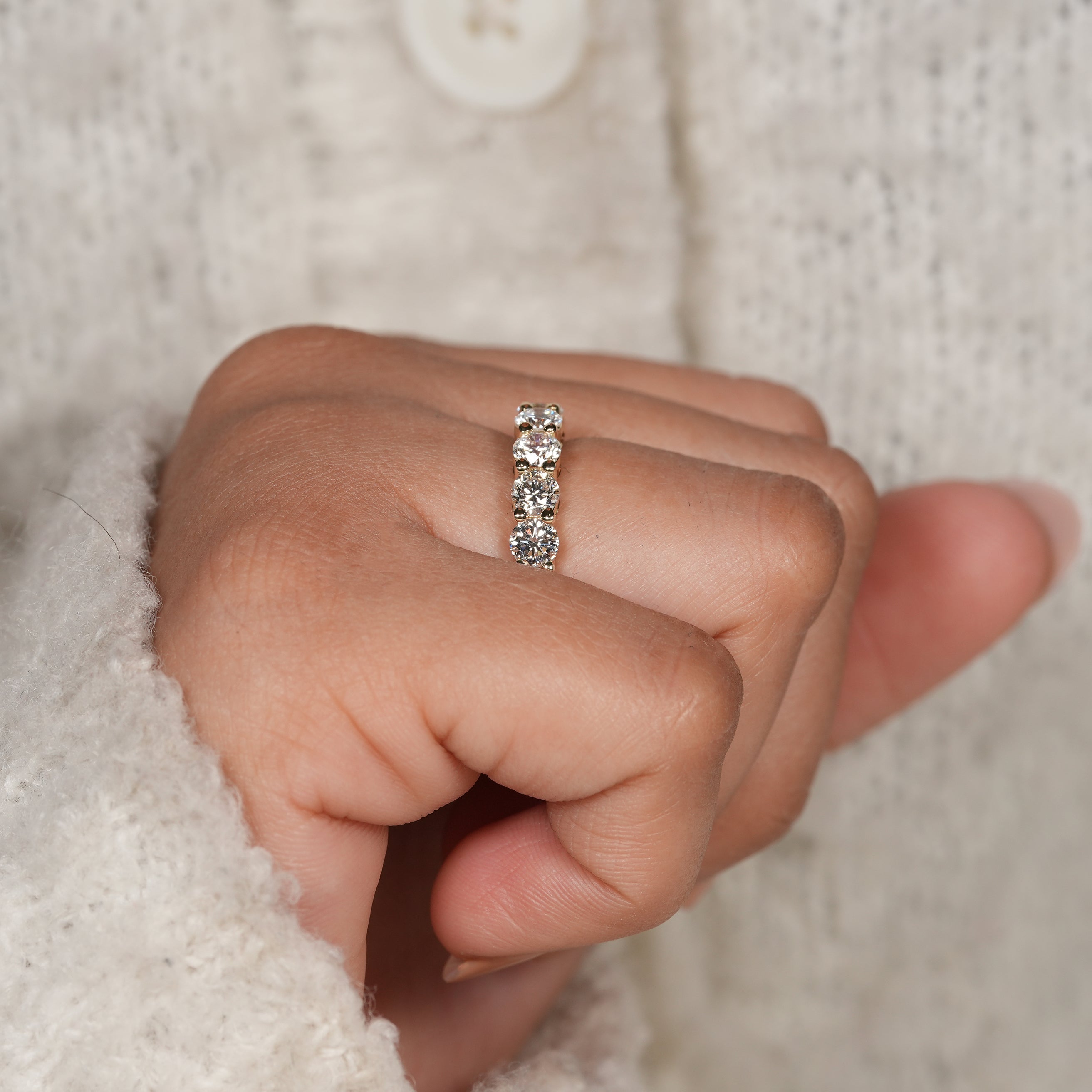 Round brilliant diamond anniversary ring in polished yellow gold