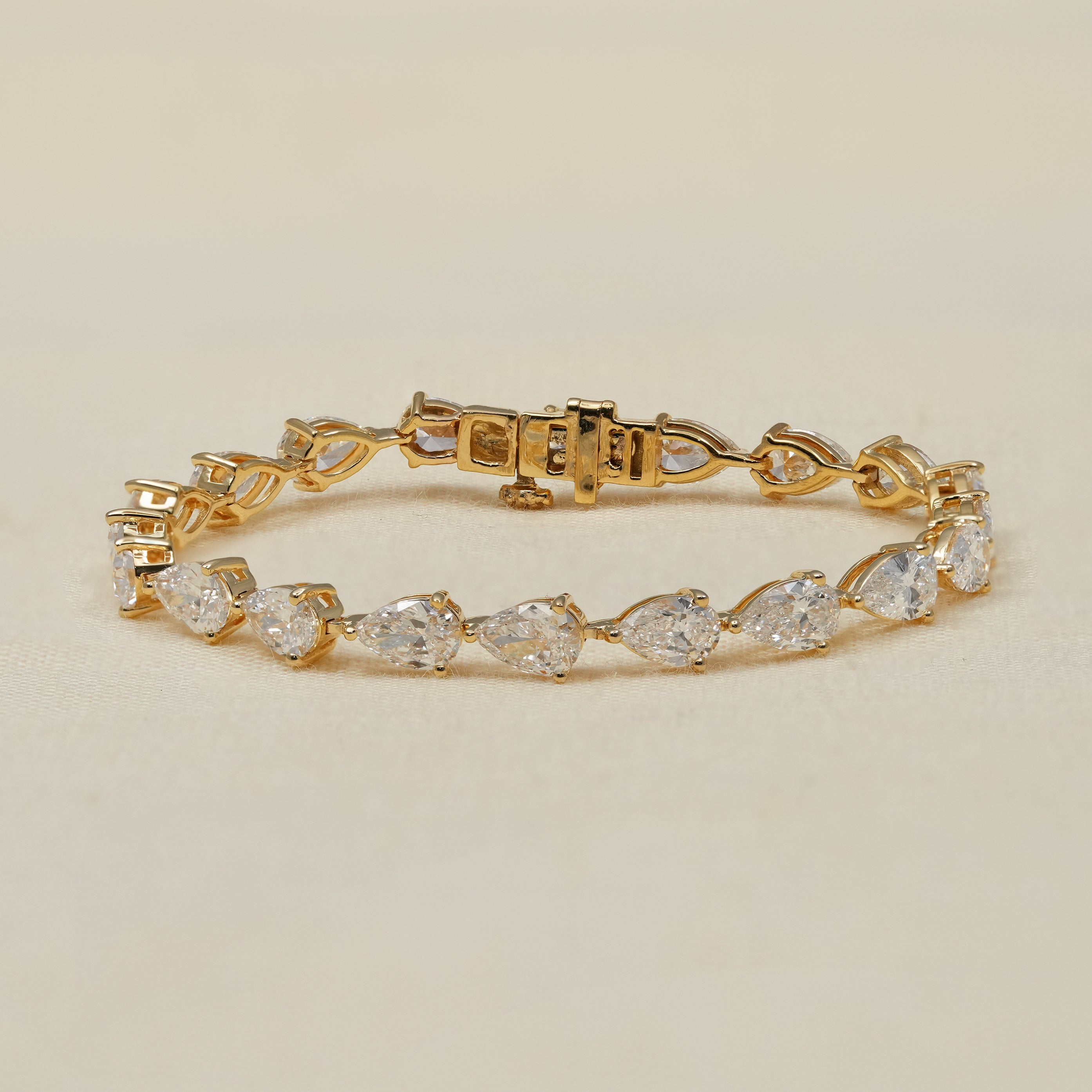 Pear lab grown diamond tennis bracelet in polished yellow gold