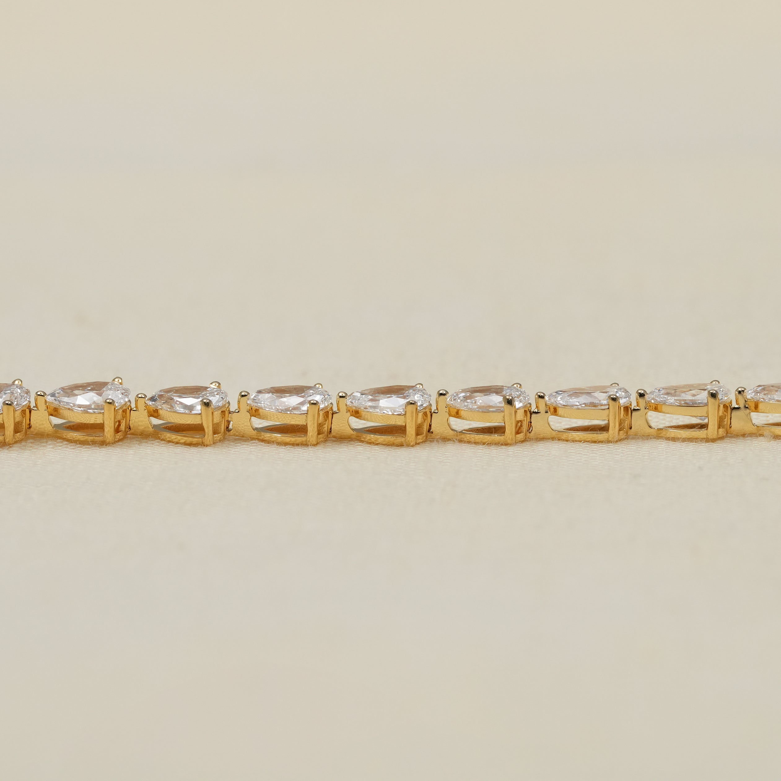 Delicate pear lab grown diamond tennis bracelet with gold links