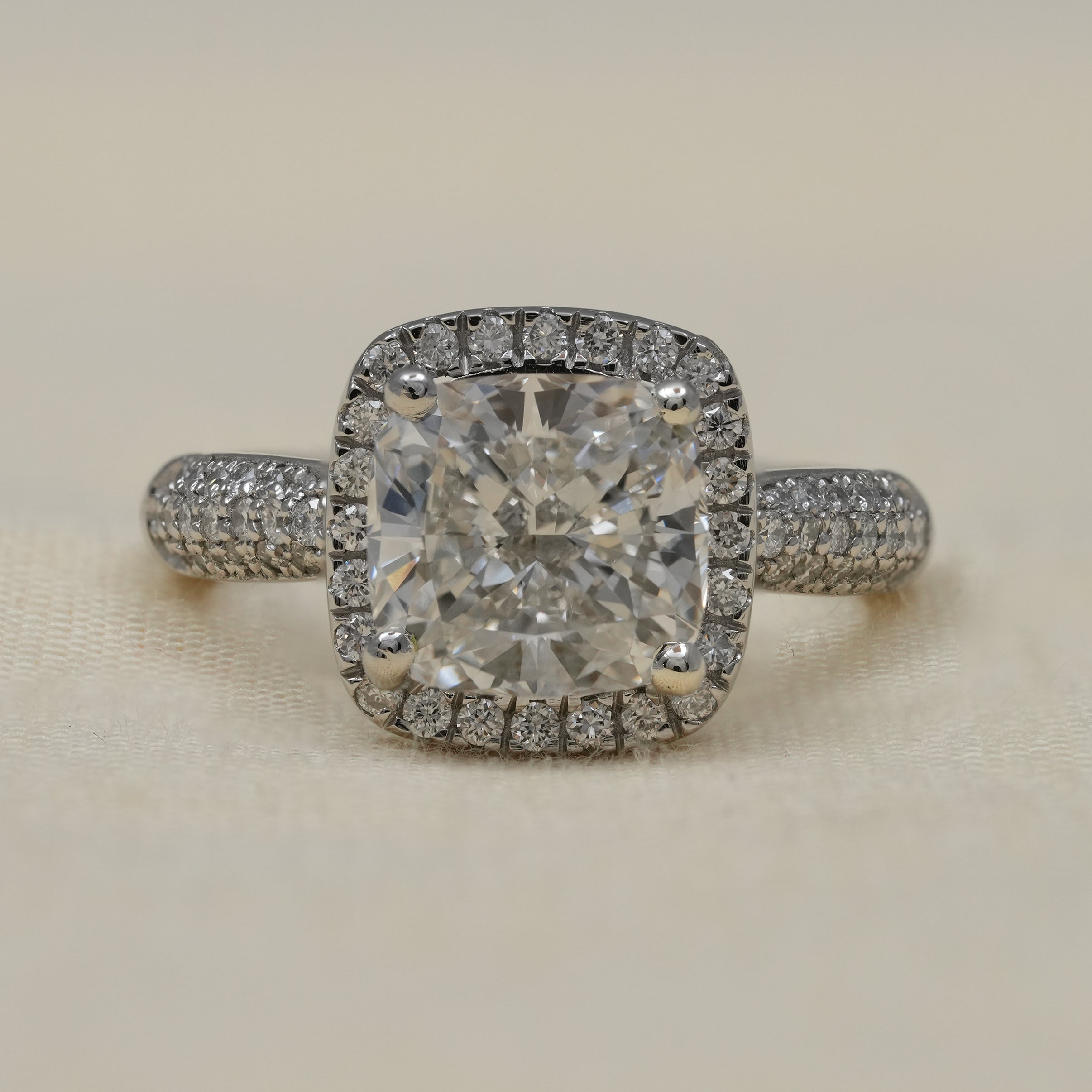 Cushion cut lab grown diamond engagement ring with halo setting