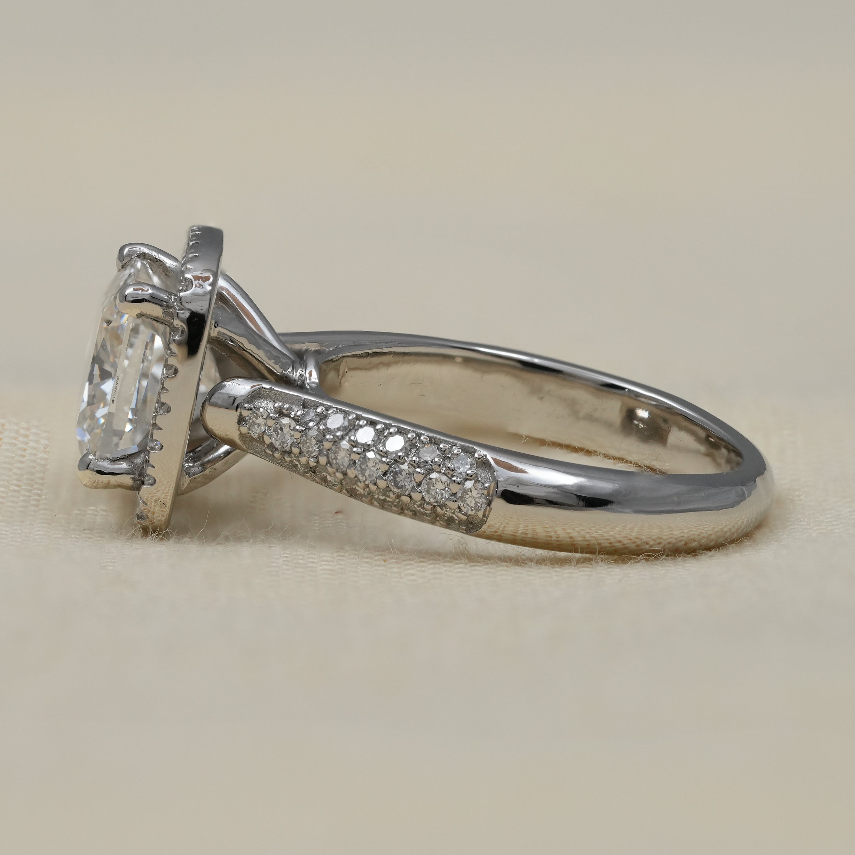 Classic halo lab grown diamond engagement ring with pavé band