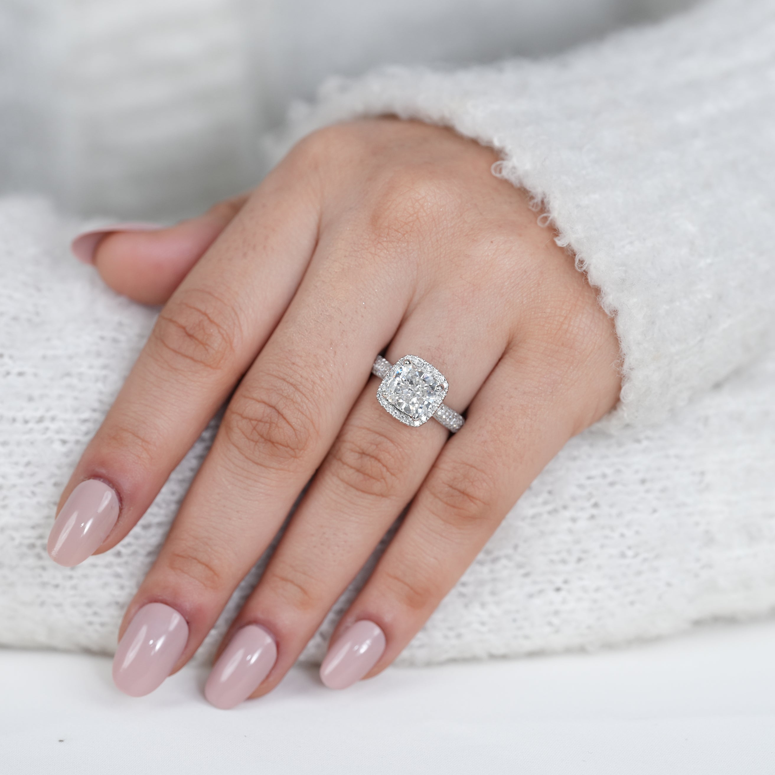 Modern cushion lab grown diamond engagement ring with halo design