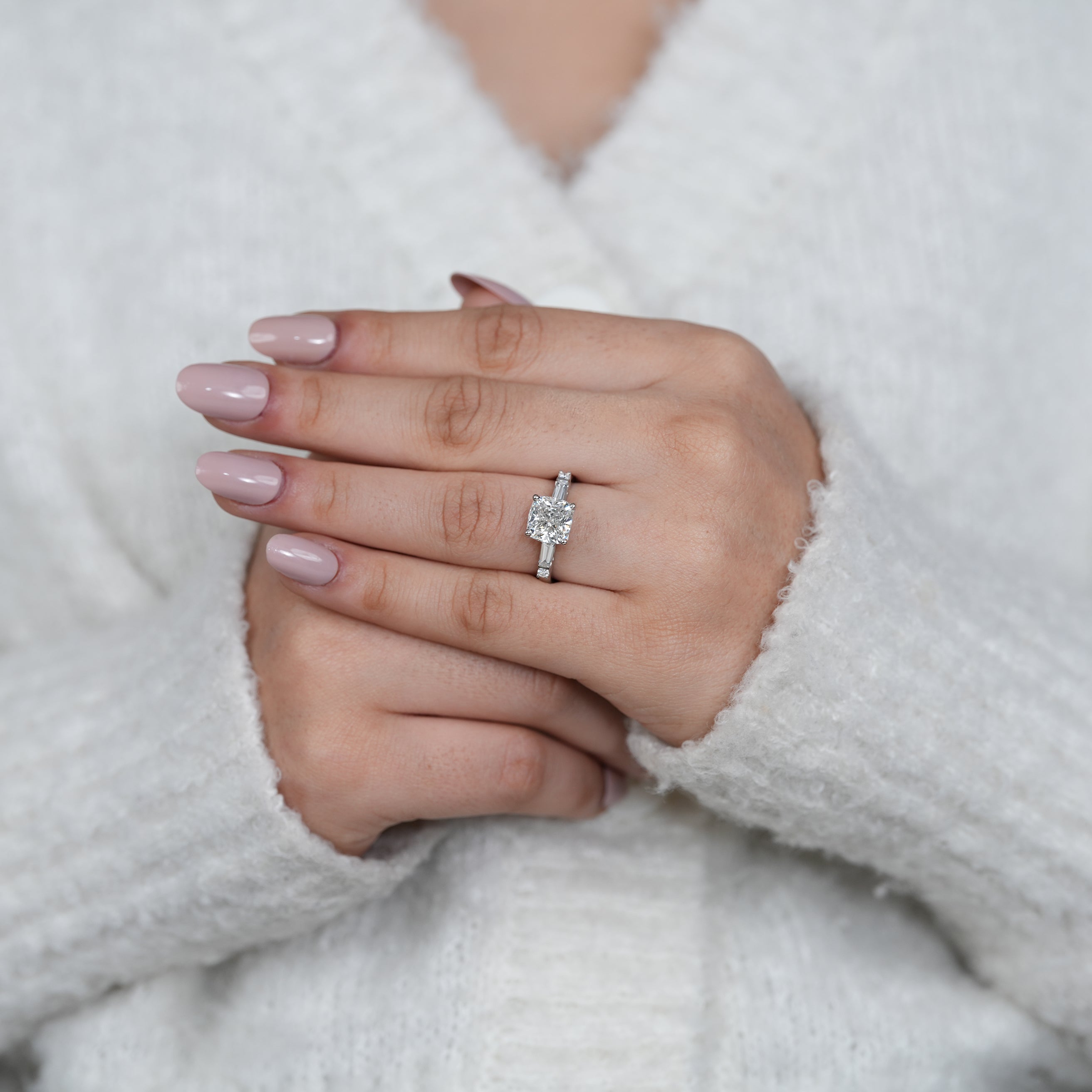 Close up cushion lab grown diamond ring with baguette stones
