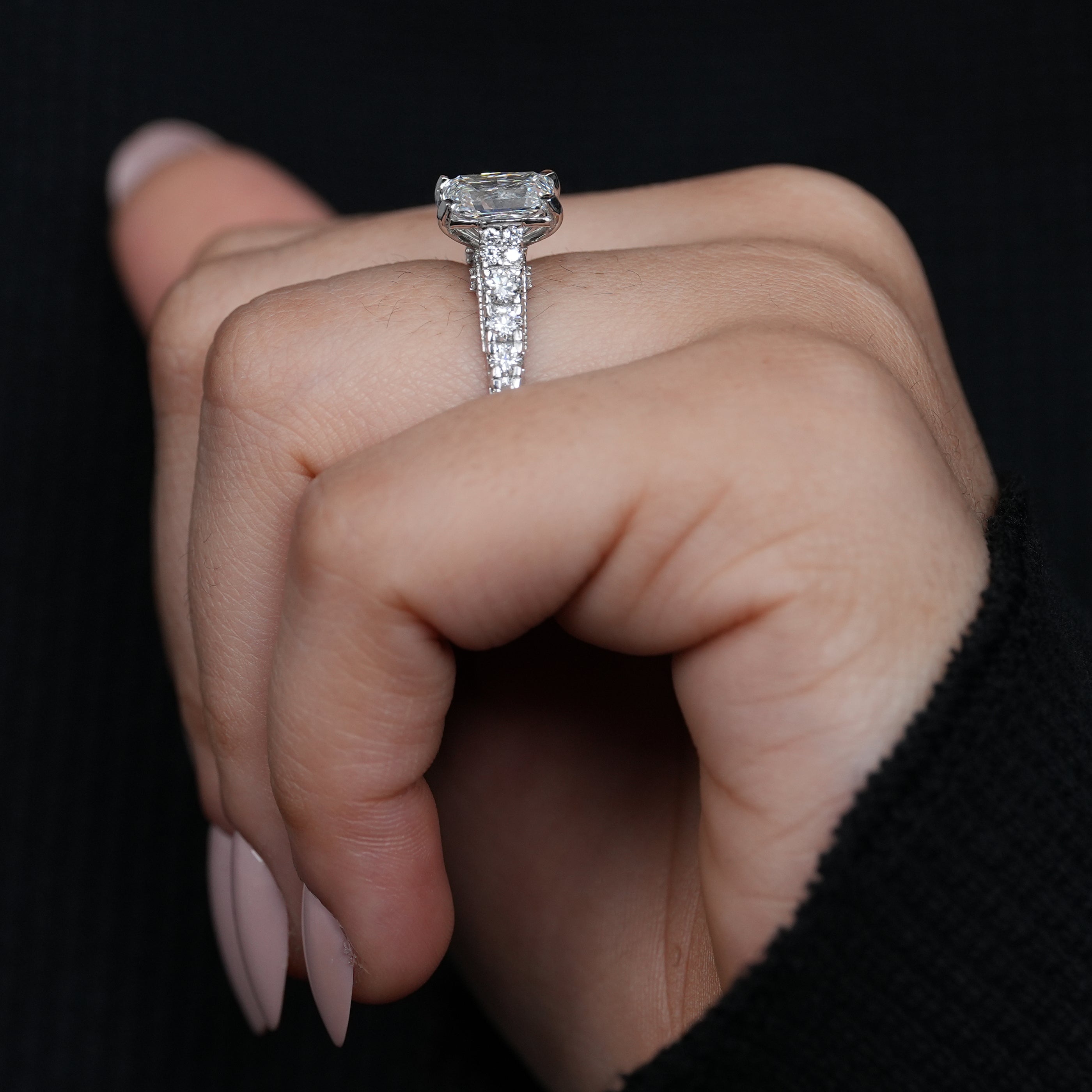 Brilliant radiant lab grown diamond ring with prong set rectangular center stone.