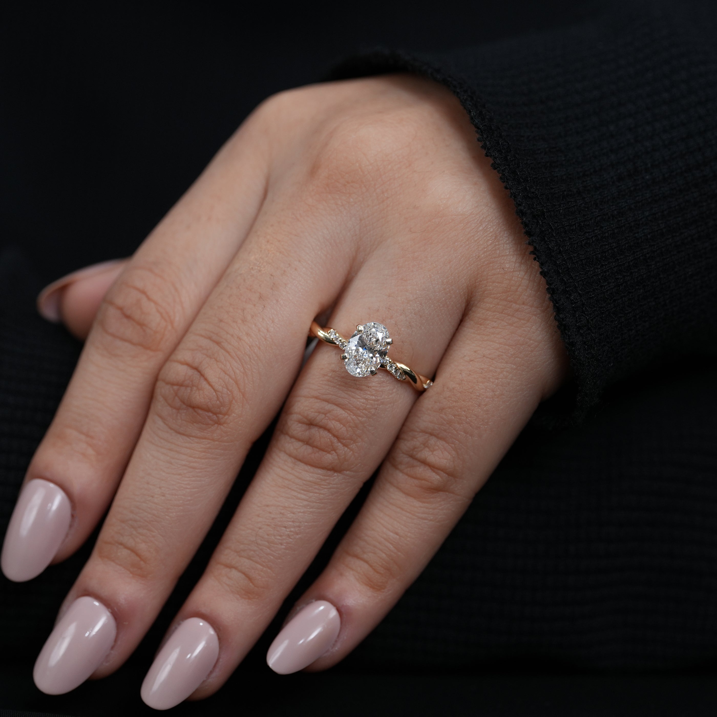 Minimalist oval lab grown diamond solitaire ring with flowing twisted band