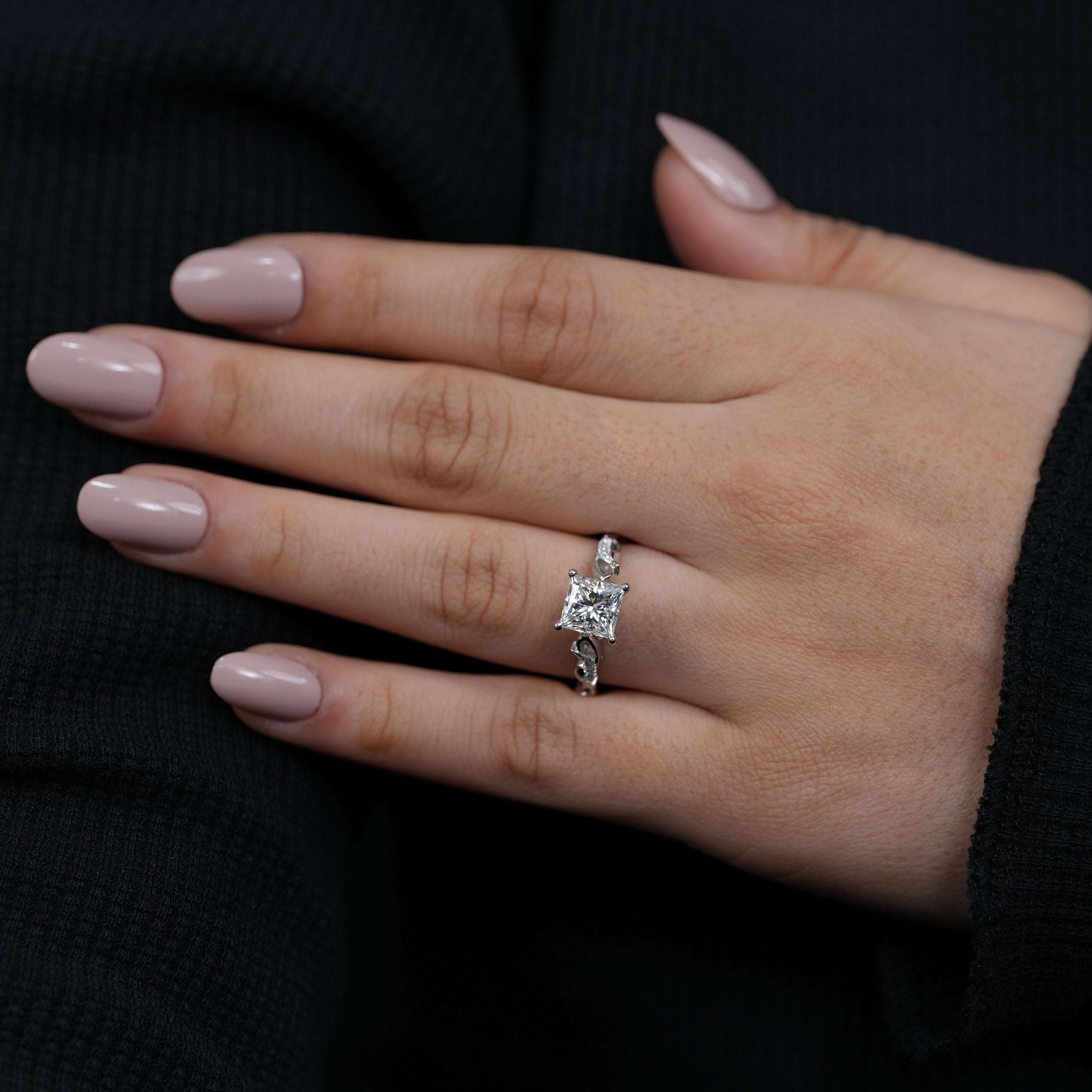 Elegant princess cut lab grown diamond proposal ring sculpted flowing band.