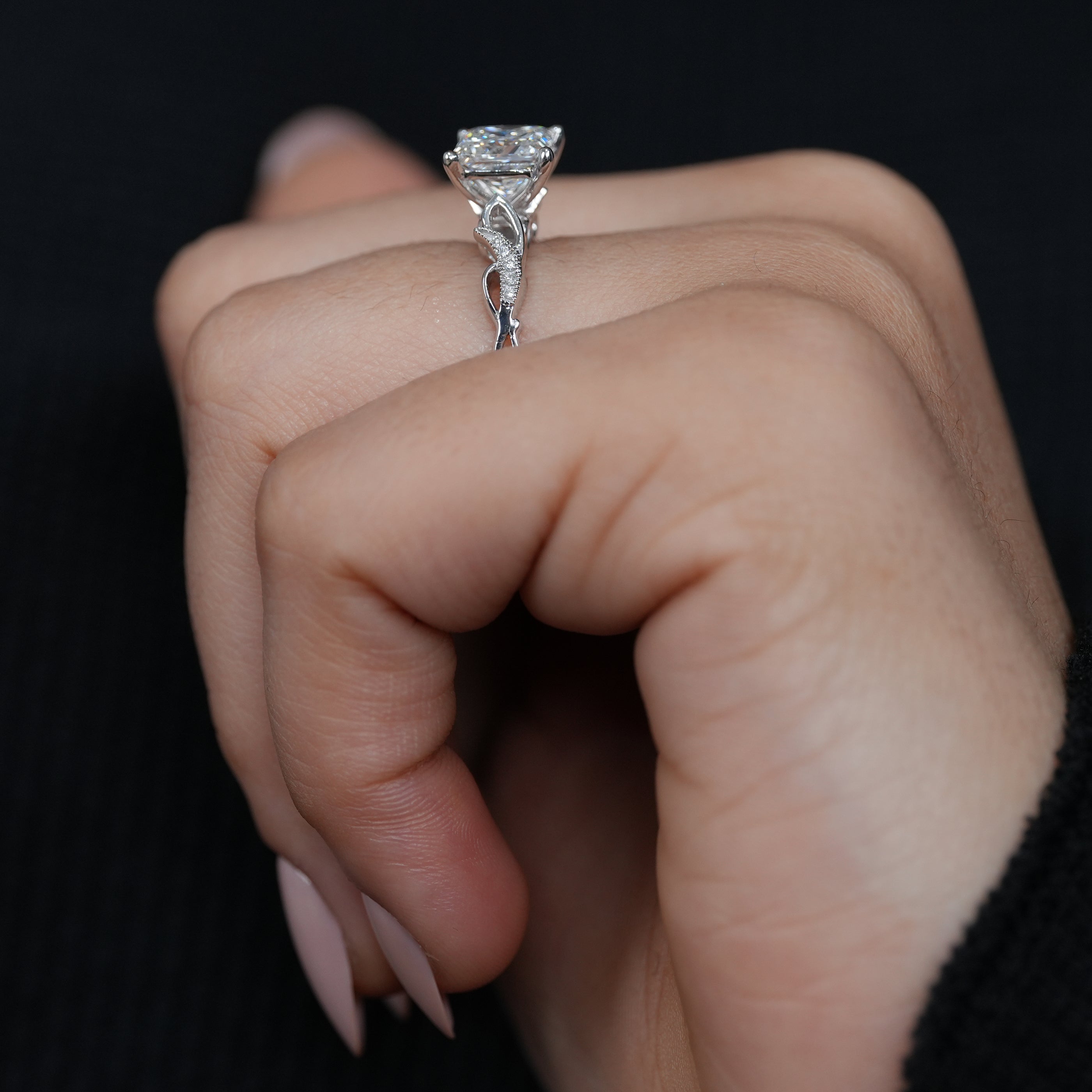 Luxury princess cut lab grown diamond ring sculptural twisted white gold band.