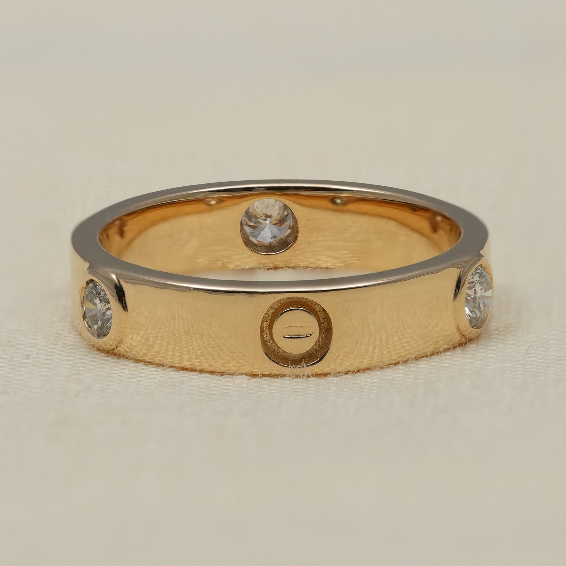 Yellow gold band ring with flush set lab grown diamonds