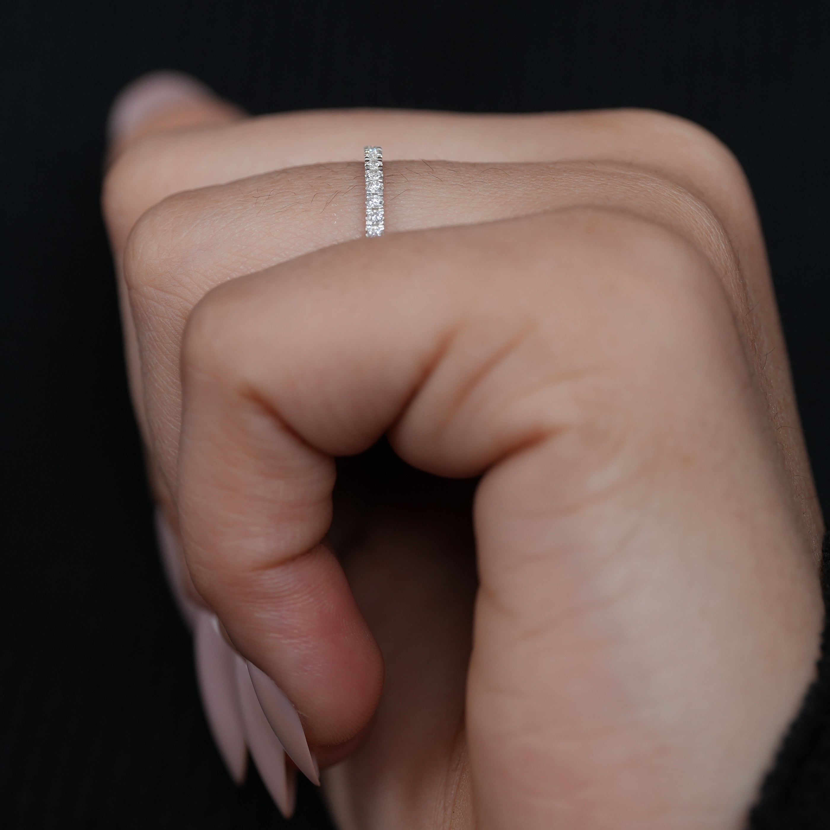 Petite lab grown diamond shared prong band delicate everyday wedding stacker.