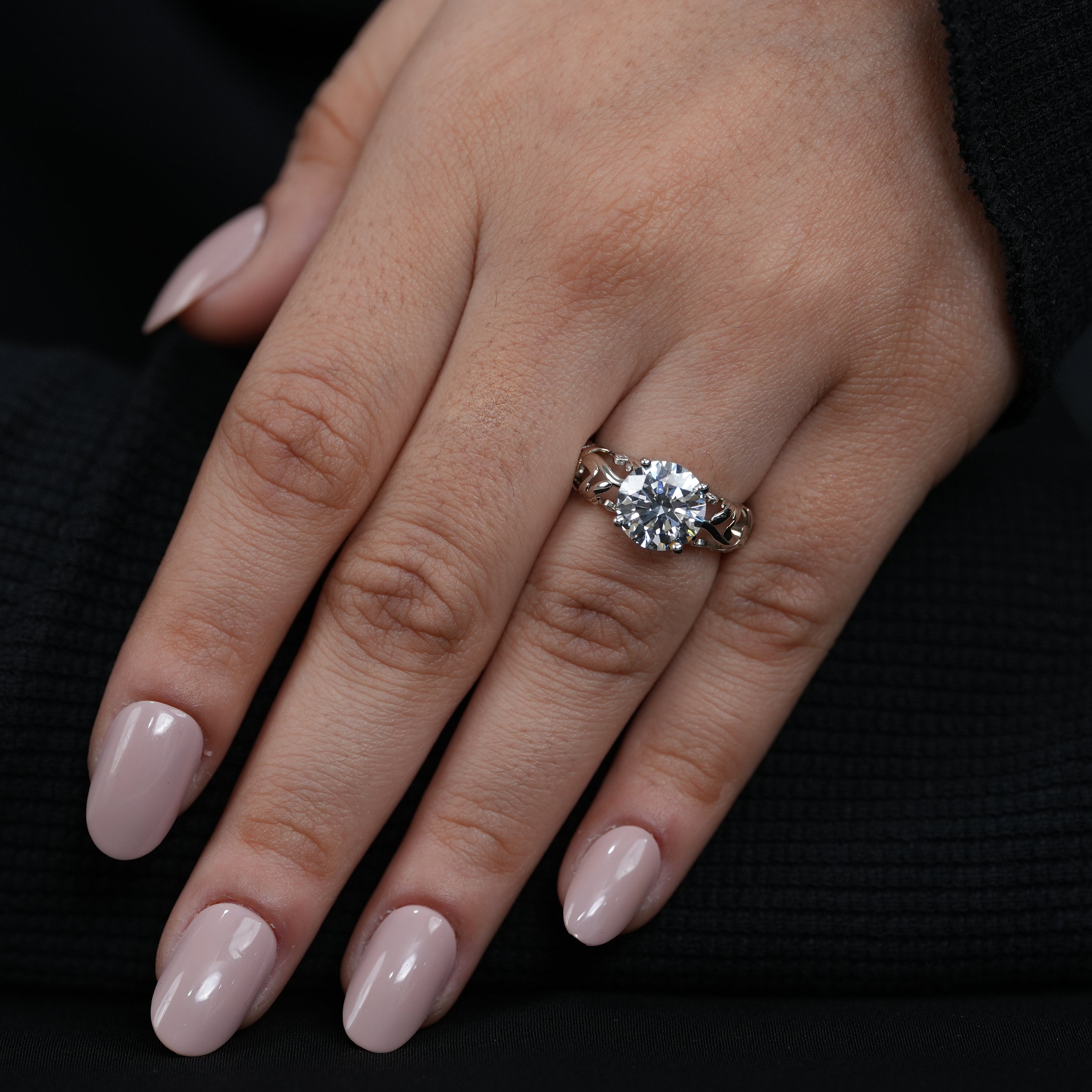 Handcrafted two tone gold ring showcasing round lab grown diamond organic vine band